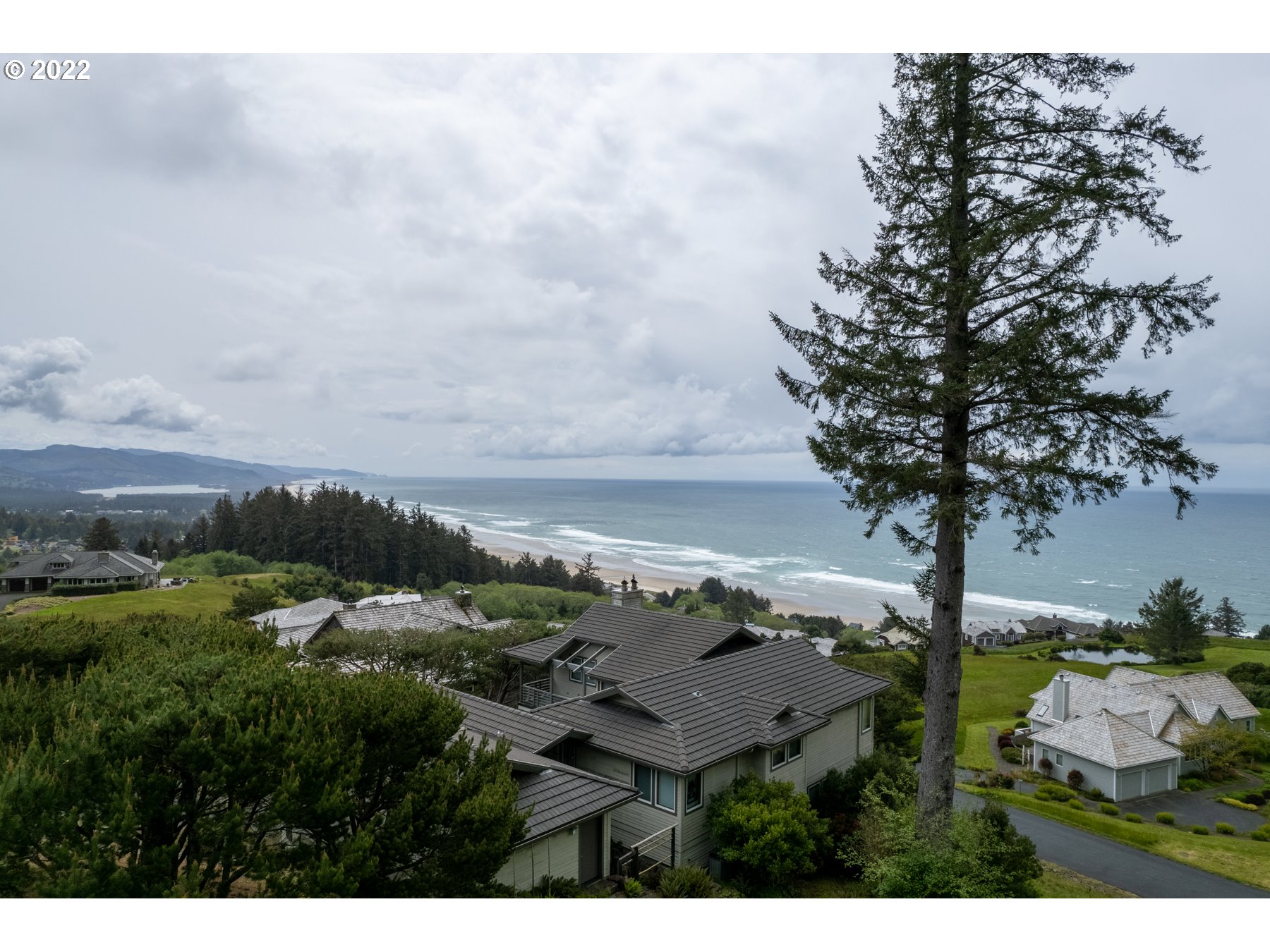 Braeridge Drive, Unit 10 Nehalem, OR 97131 - Photo 3 of 26 a view of an outdoor space and mountain view