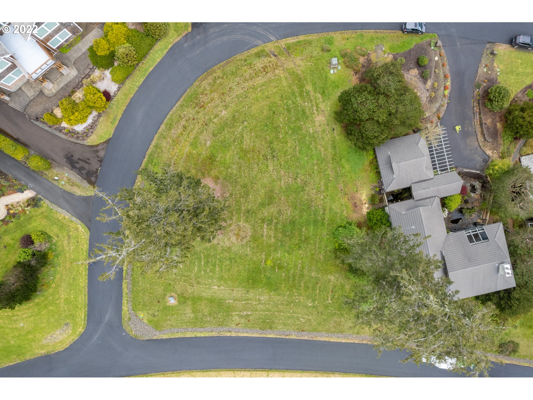 Braeridge Drive, Unit 10 Nehalem, OR 97131 - Photo 4 of 26 an aerial view of a residential houses with outdoor space and swimming pool