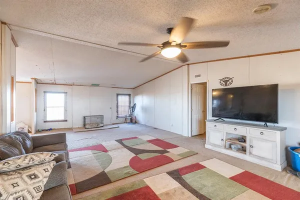a kitchen with granite countertop a sink stove and refrigerator