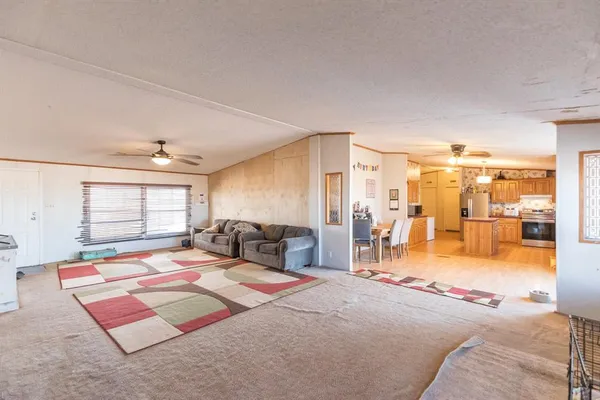 a kitchen with cabinets and window