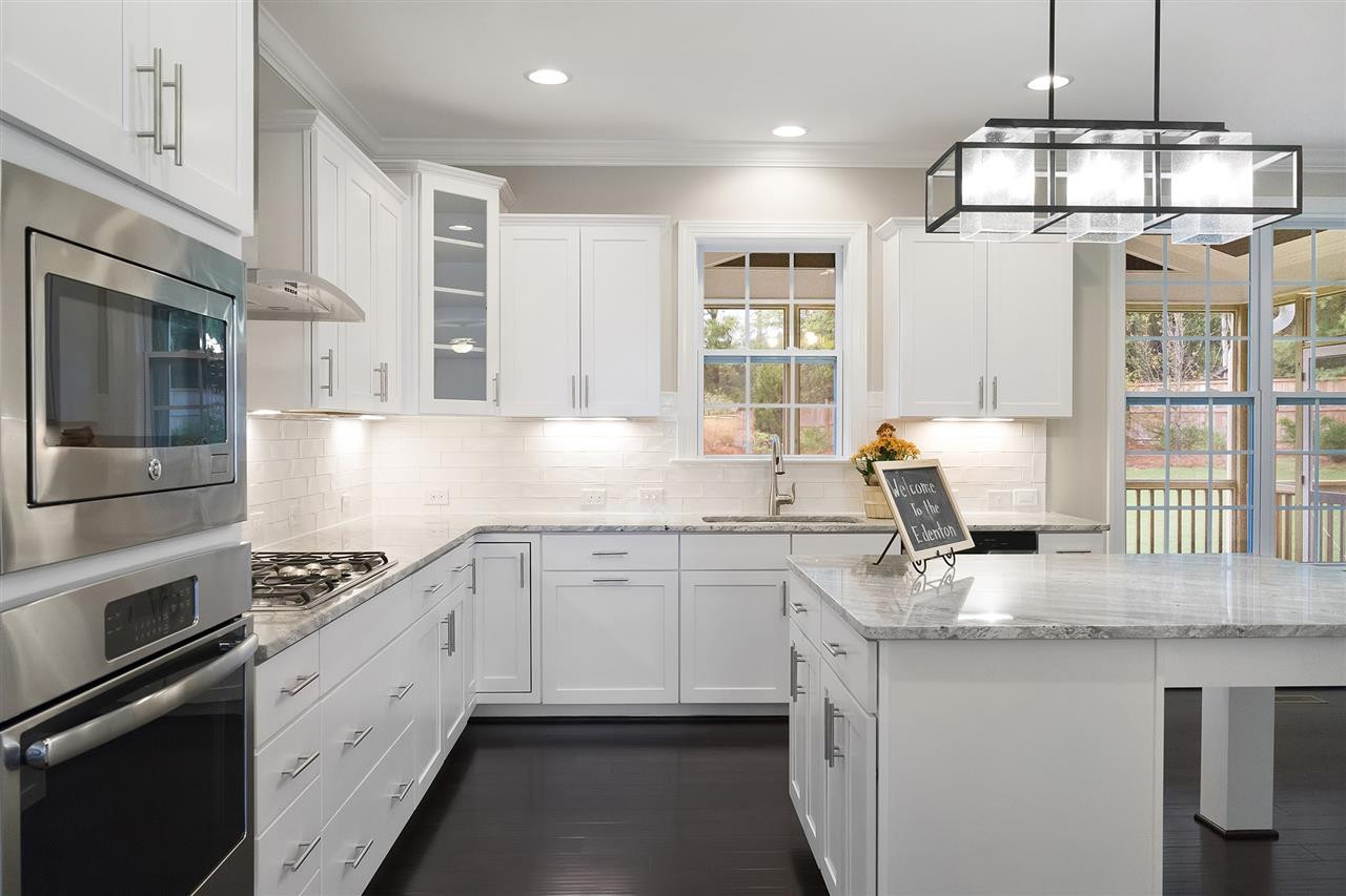 1405 Baxter Ridge Court Apex, NC 27502 - Photo 7 of 25 gourmet kitchen with upgraded appliances as well as granite, tile back slash and hardwood floors gorgeous gourmet kitchen