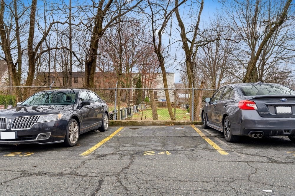 135 Granite Avenue, Unit 49 Boston, MA 02124 - Photo 12 of 14 a car parked in front of a house