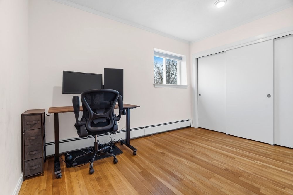 135 Granite Avenue, Unit 49 Boston, MA 02124 - Photo 8 of 14 a view of workspace with wooden floor windows