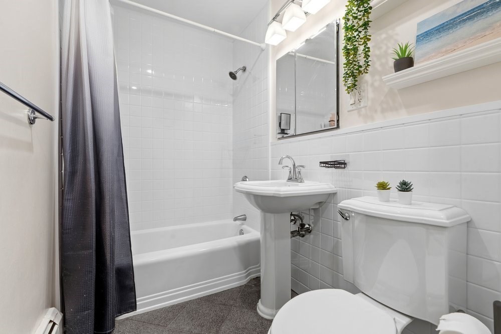 135 Granite Avenue, Unit 49 Boston, MA 02124 - Photo 9 of 14 a bathroom with a sink toilet and shower