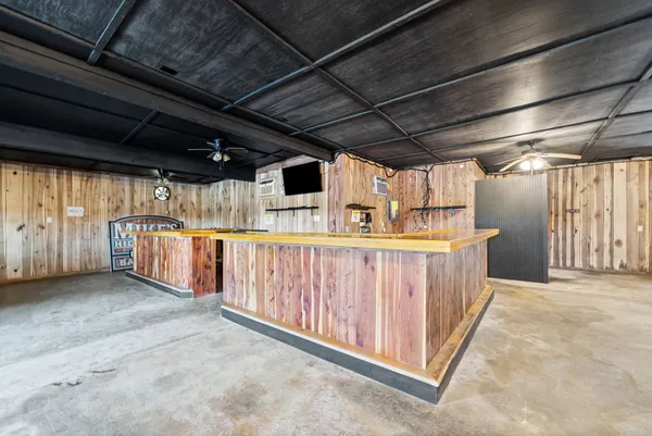 a view of a room with wooden walls