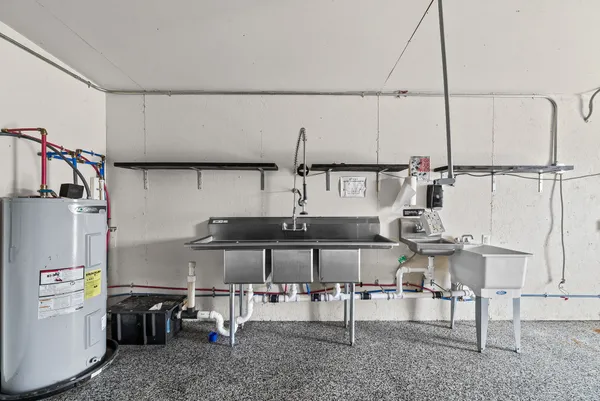 a kitchen with stainless steel appliances refrigerator and stove