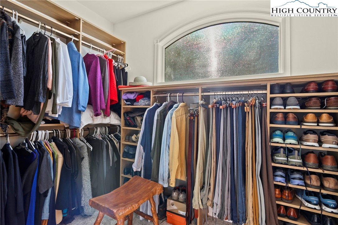 110 Pinnacle Ridge Road Beech Mountain, NC 28604 - Photo 22 of 49 a view of walk in closet with clothes and shoes