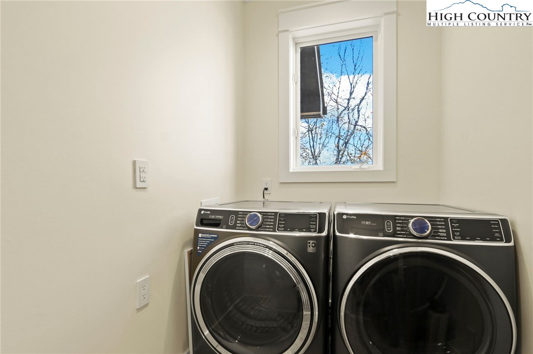 110 Pinnacle Ridge Road Beech Mountain, NC 28604 - Photo 23 of 49 a utility room with dryer and washer