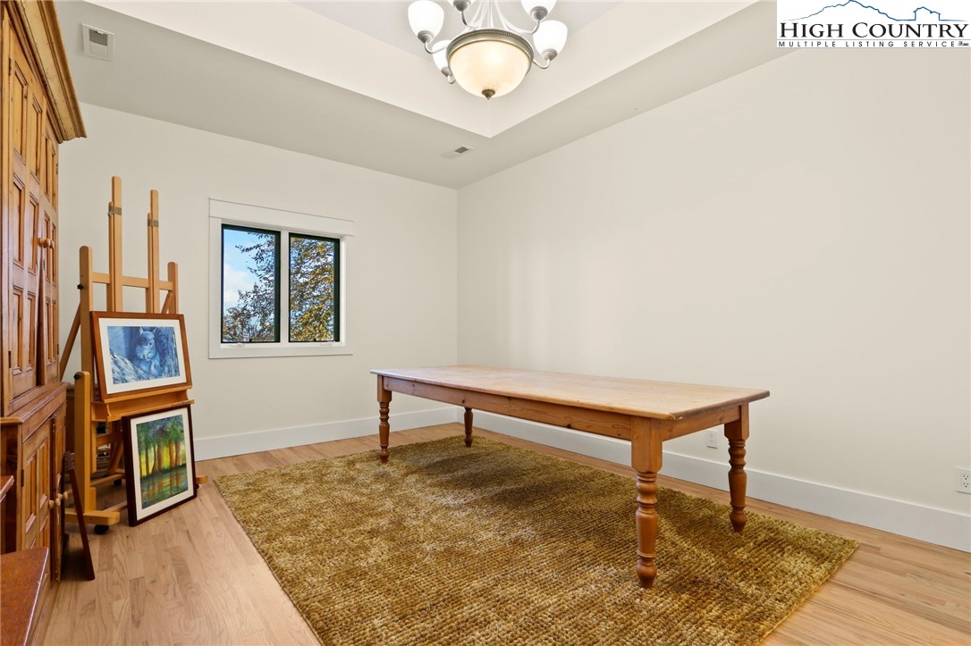 110 Pinnacle Ridge Road Beech Mountain, NC 28604 - Photo 35 of 49 a view of a livingroom with wooden floor and furniture