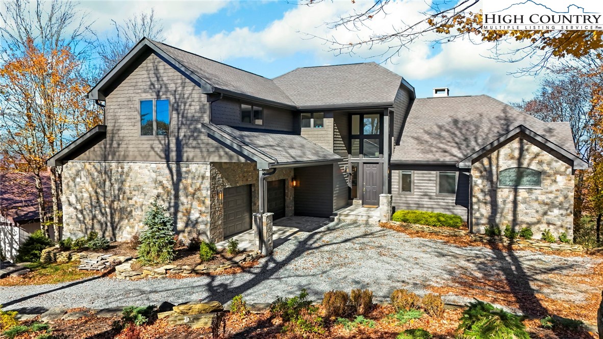110 Pinnacle Ridge Road Beech Mountain, NC 28604 - Photo 48 of 49 a front view of a house with garden