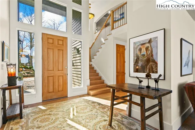a view of a hallway with furniture and entryway