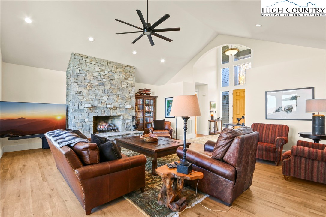 110 Pinnacle Ridge Road Beech Mountain, NC 28604 - Photo 8 of 49 a living room with furniture and a fireplace