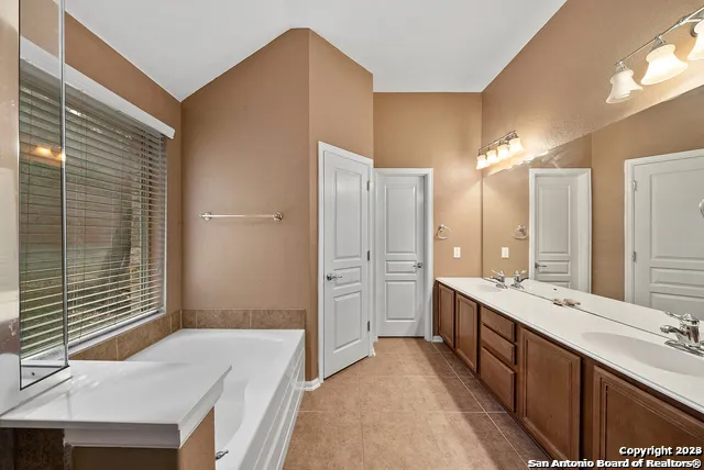 a bathroom with a bathtub and shower