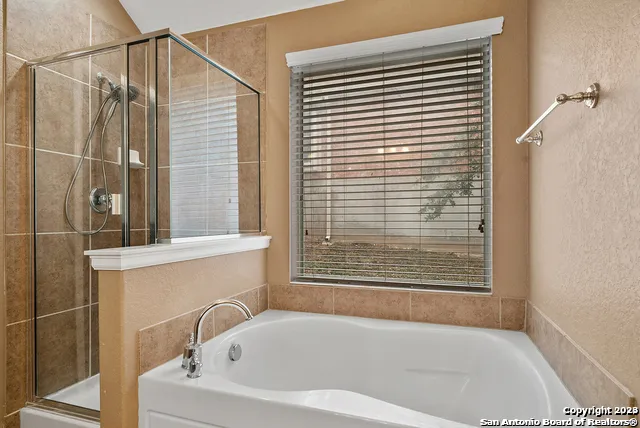 a backyard of a house with a table and chairs