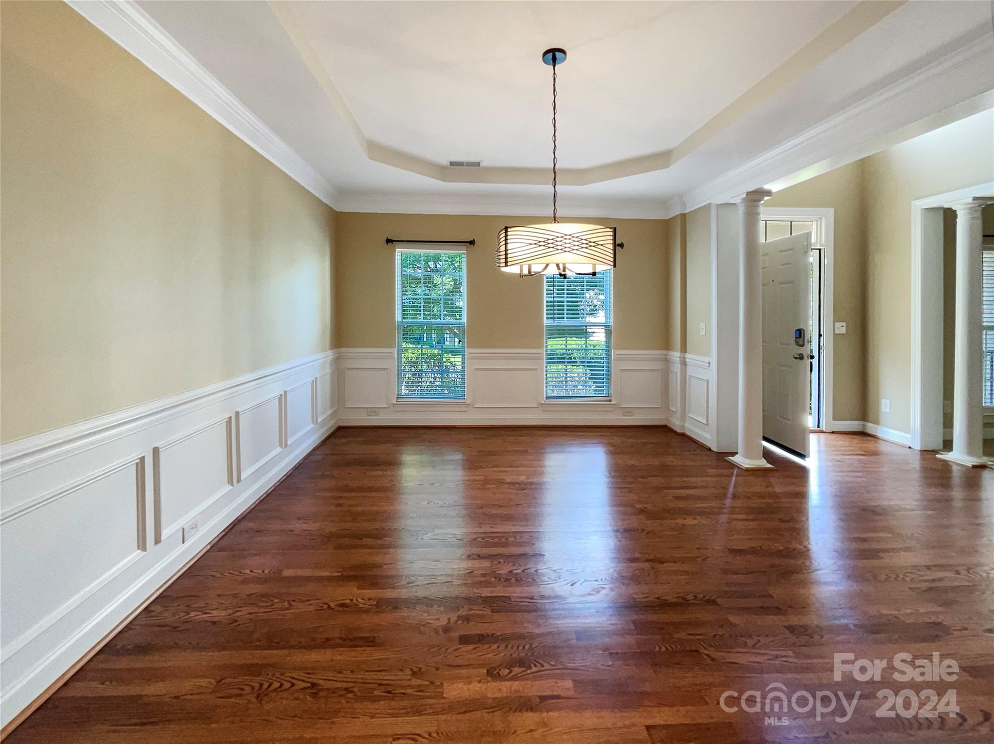 604 Panthers Way Fort Mill, SC 29708 - Photo 12 of 24 a view of an empty room with wooden floor and a window