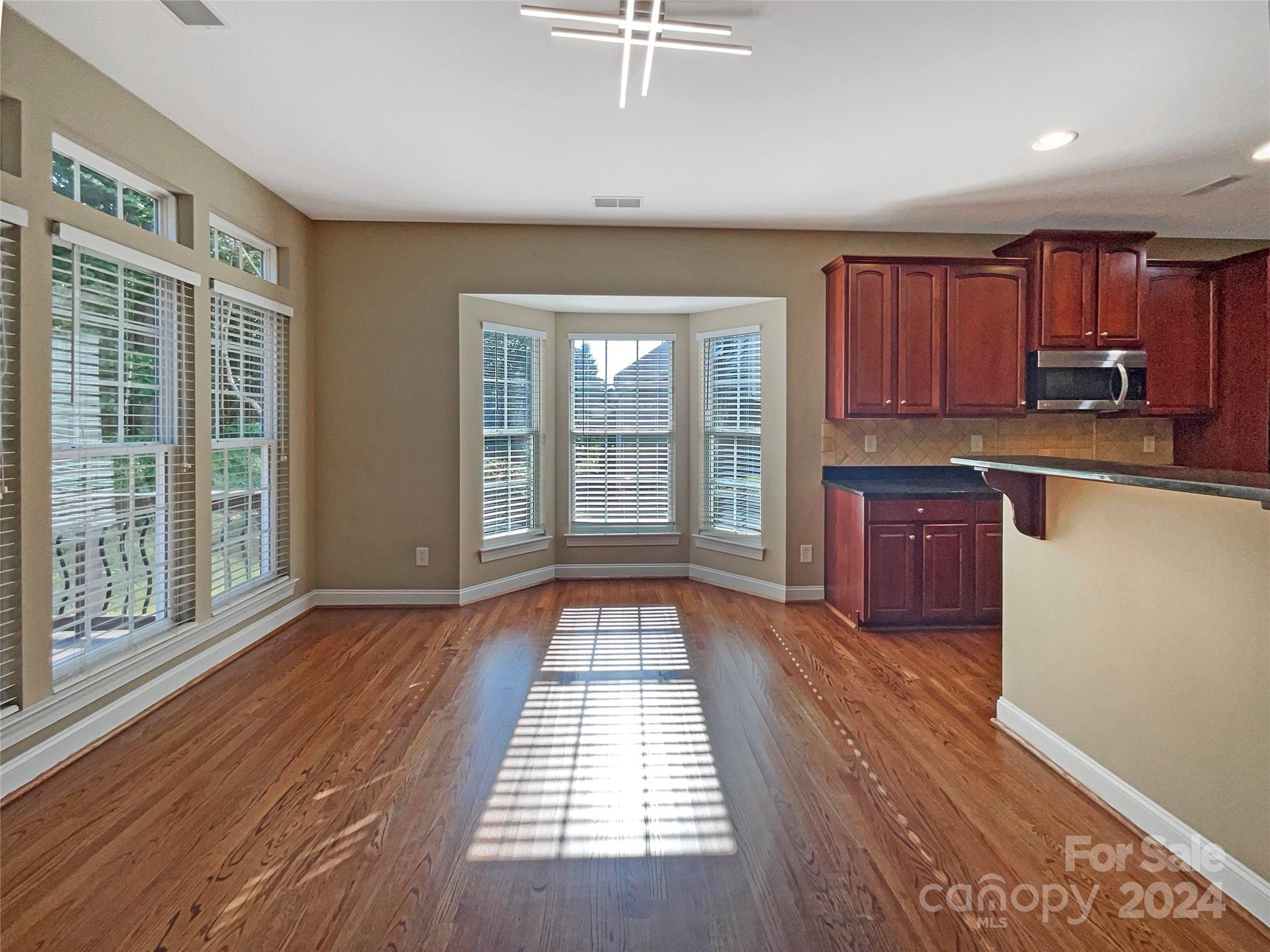 604 Panthers Way Fort Mill, SC 29708 - Photo 15 of 24 a view of kitchen with wooden floor and a sink