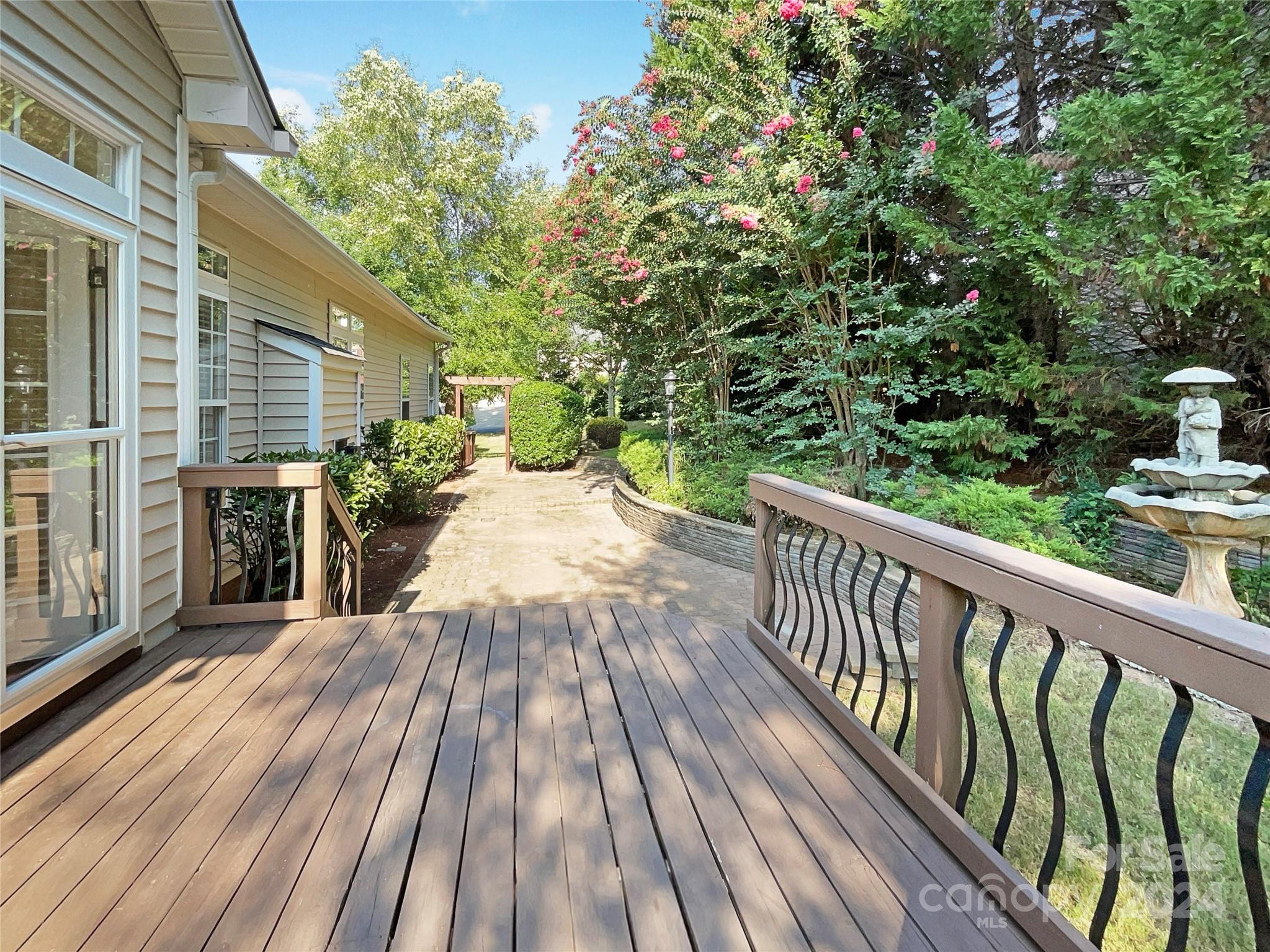 604 Panthers Way Fort Mill, SC 29708 - Photo 16 of 24 a view of backyard with a deck and wooden floor