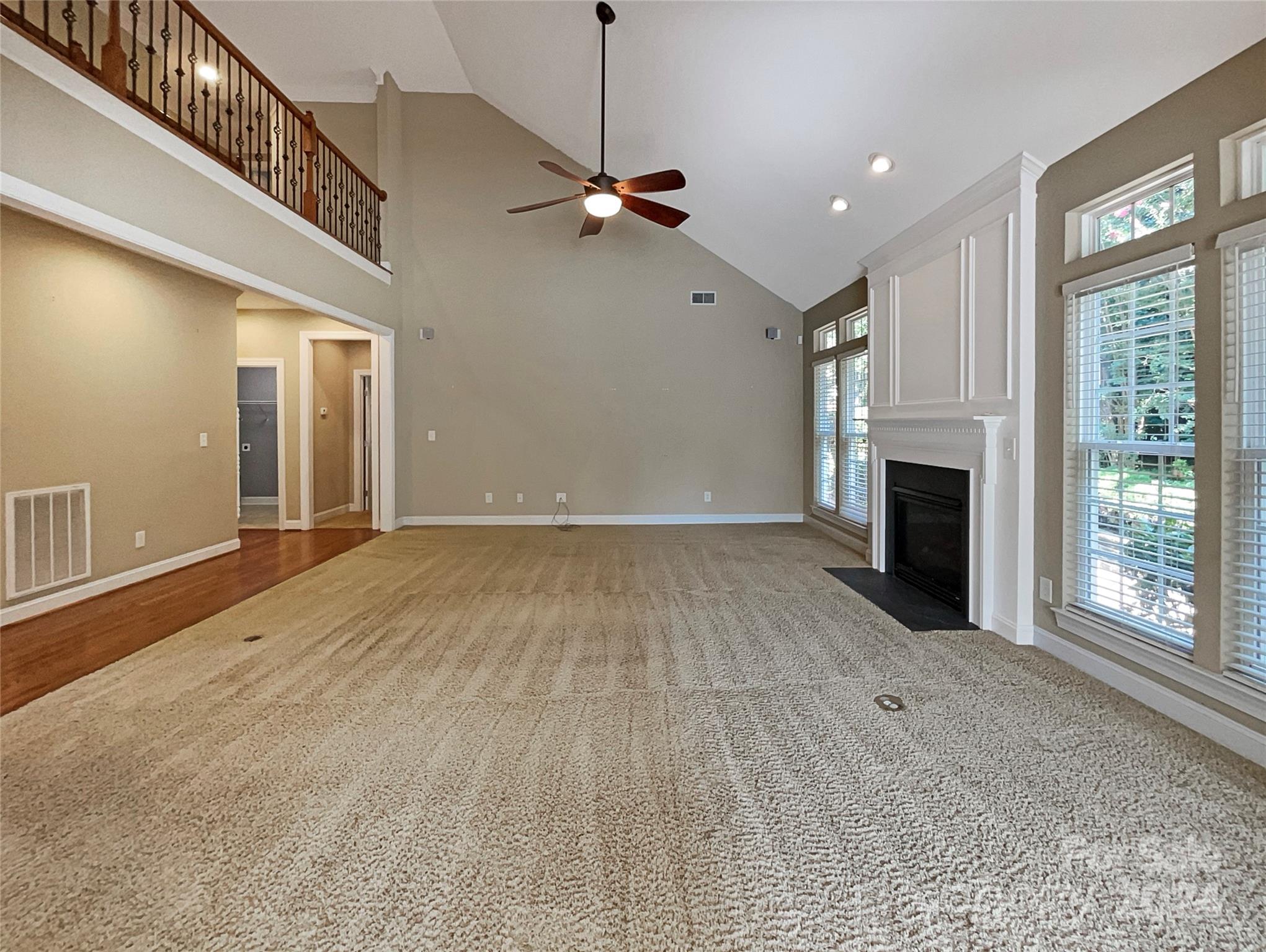 604 Panthers Way Fort Mill, SC 29708 - Photo 17 of 24 a view of a livingroom with a ceiling fan and window