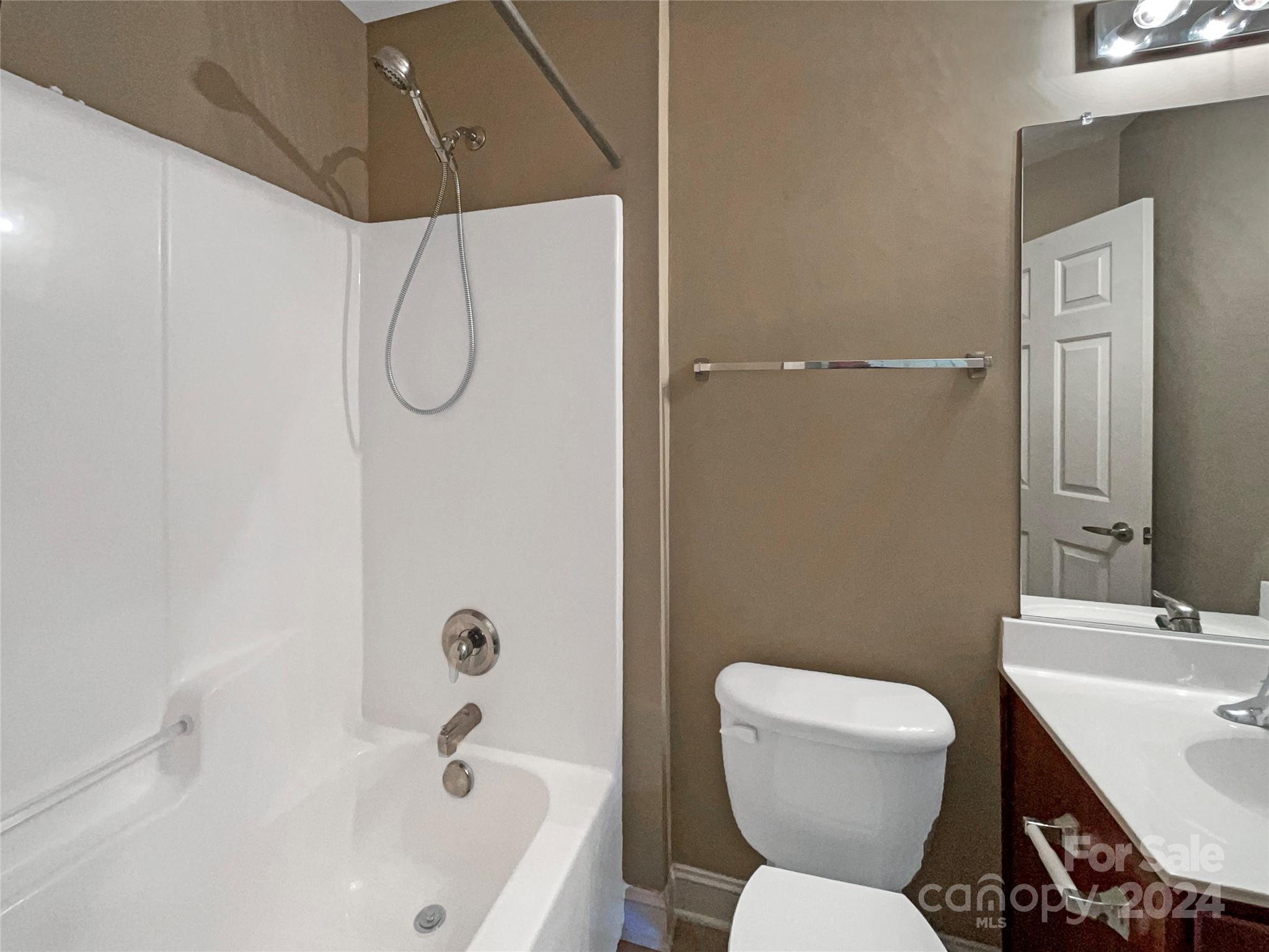 604 Panthers Way Fort Mill, SC 29708 - Photo 21 of 24 a bathroom with a sink a toilet and shower