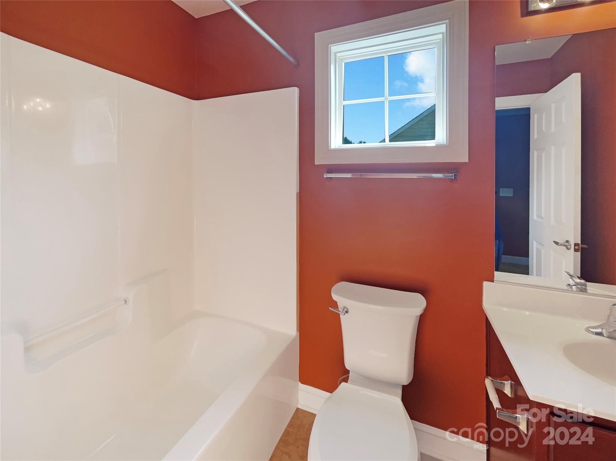 604 Panthers Way Fort Mill, SC 29708 - Photo 24 of 24 a bathroom with a toilet a sink and a bathtub