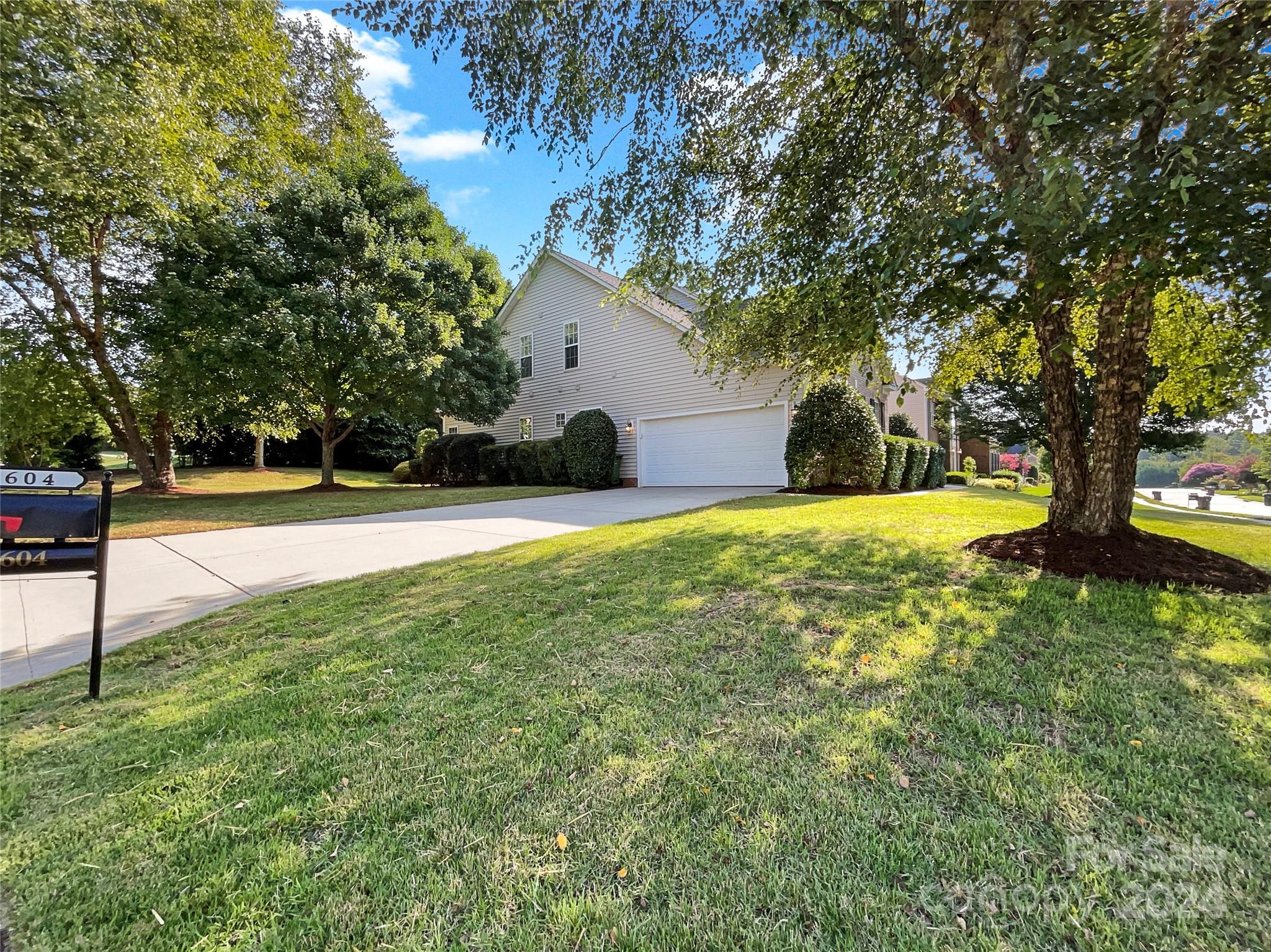 604 Panthers Way Fort Mill, SC 29708 - Photo 10 of 24 a view of yard with swimming pool and trees
