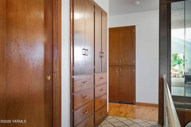 a bedroom with furniture and a window