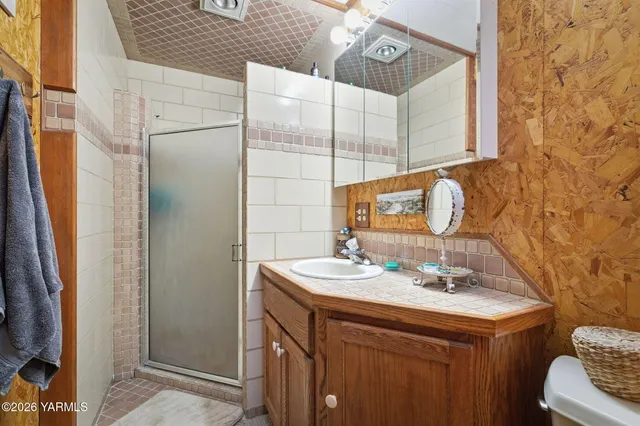 a view of a big yard with a house in the background