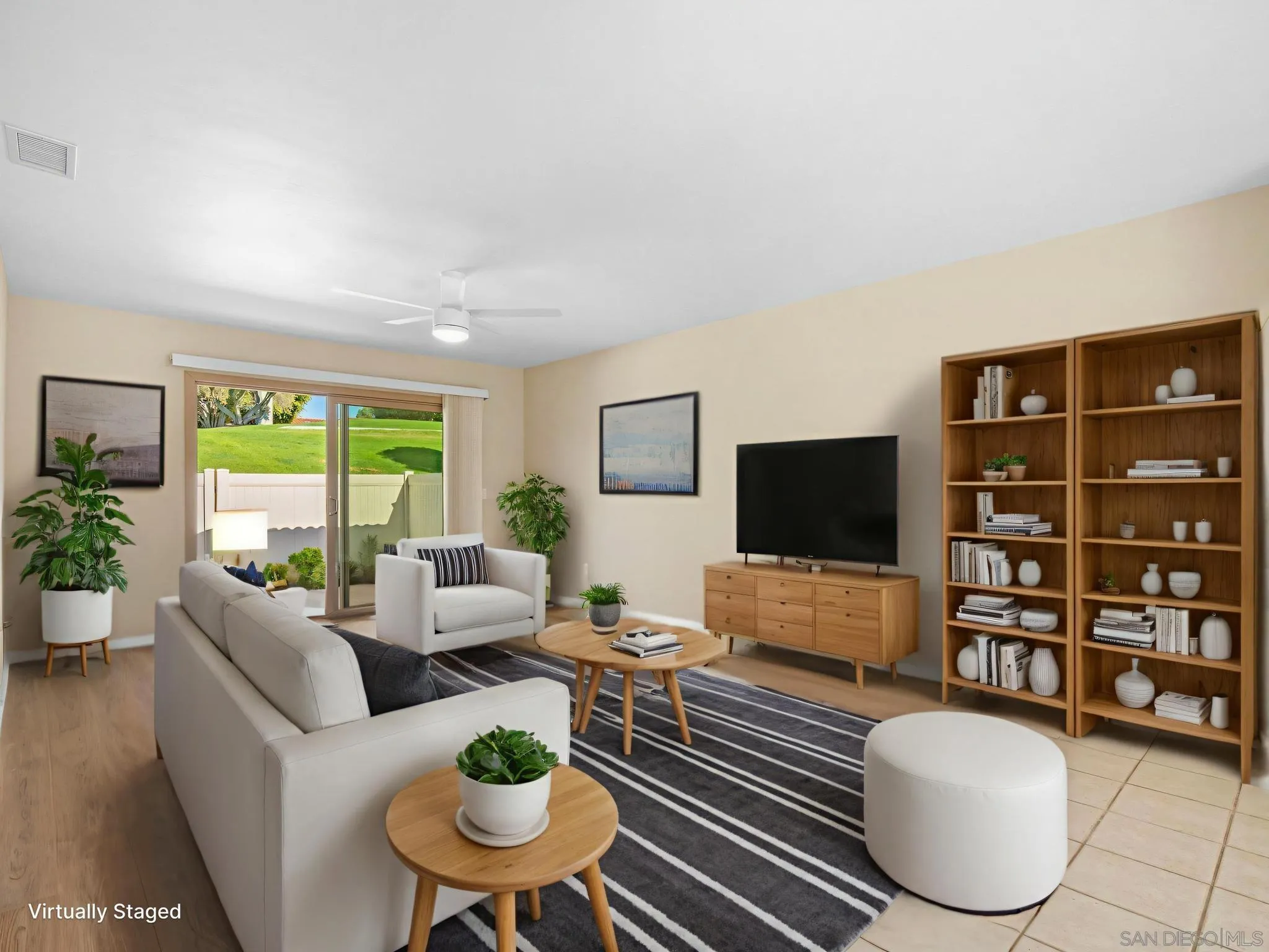 1822 Stanton Road Encinitas, CA 92024 - Photo 5 of 21 a living room with furniture a floor to ceiling window and a flat screen tv