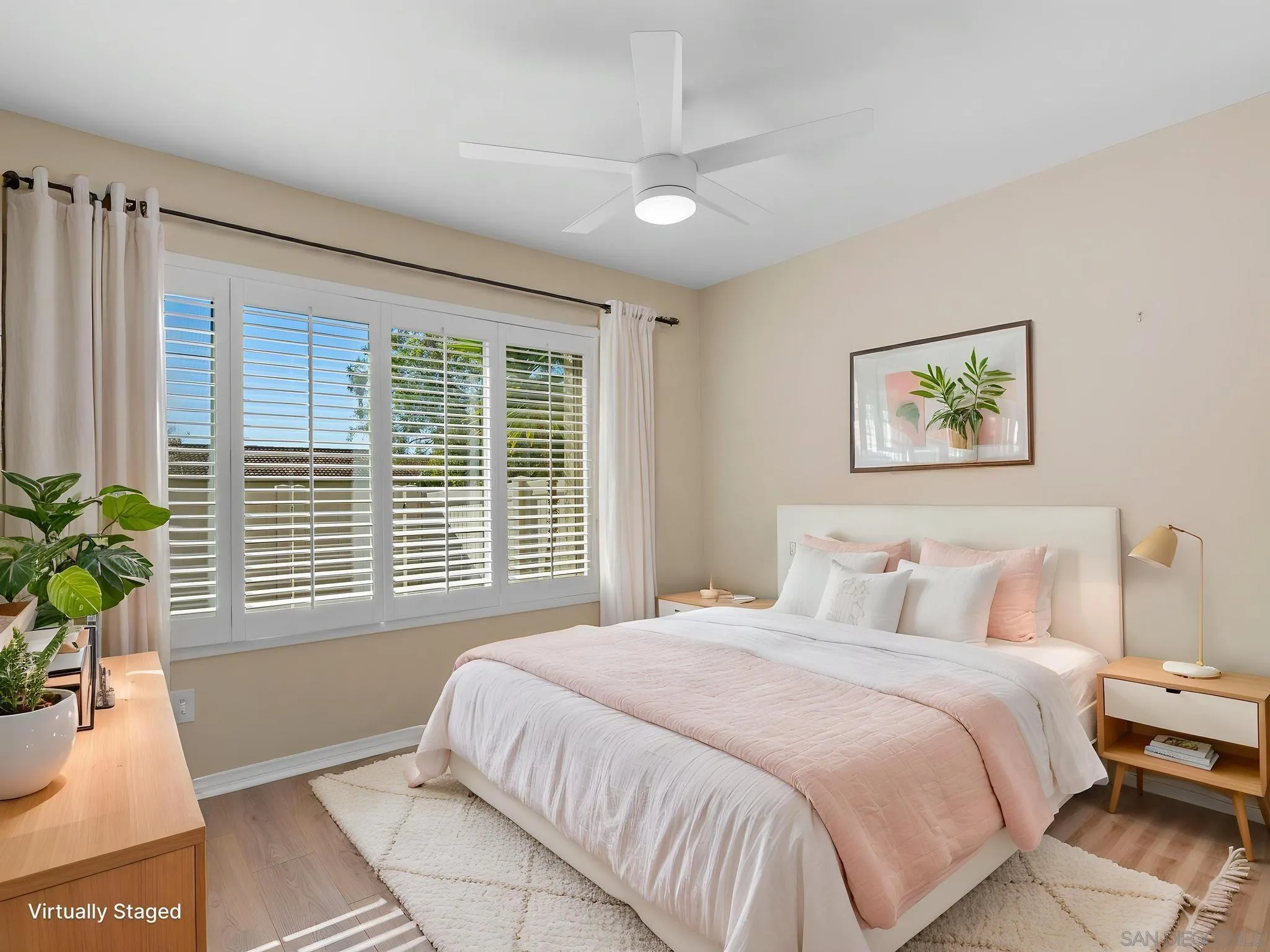 1822 Stanton Road Encinitas, CA 92024 - Photo 7 of 21 a bedroom with a large bed and a potted plant