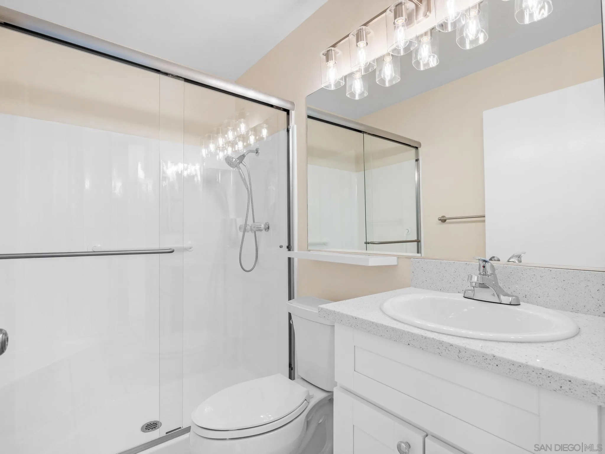 1822 Stanton Road Encinitas, CA 92024 - Photo 8 of 21 a bathroom with a sink a toilet and shower
