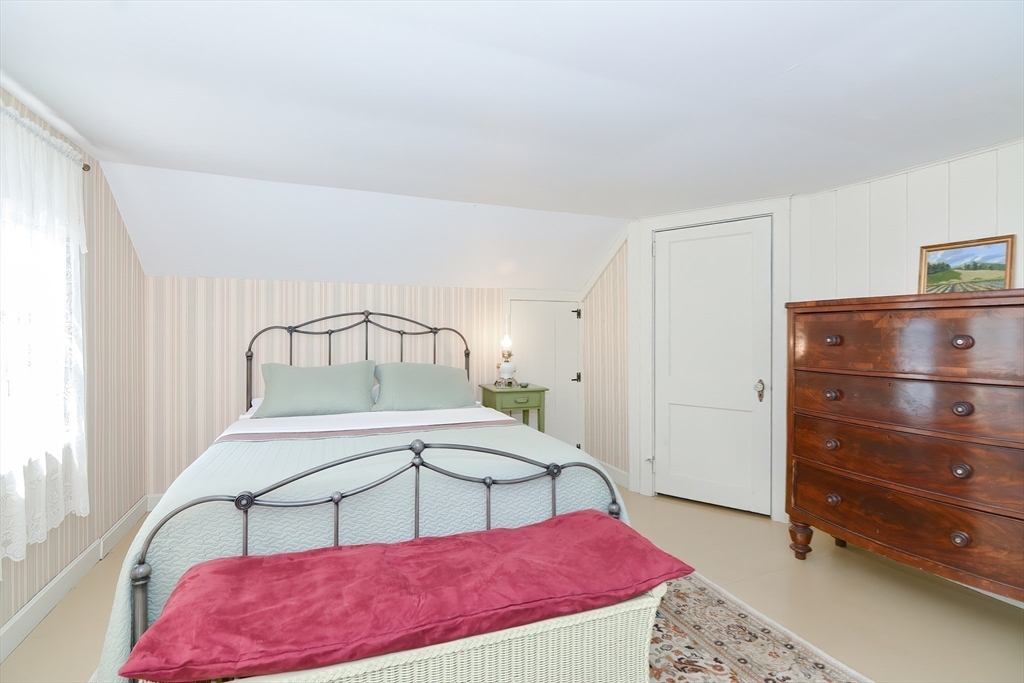 366 Breakneck Road Southbridge, MA 01550 - Photo 12 of 33 a bedroom with a bed a lamp and closet