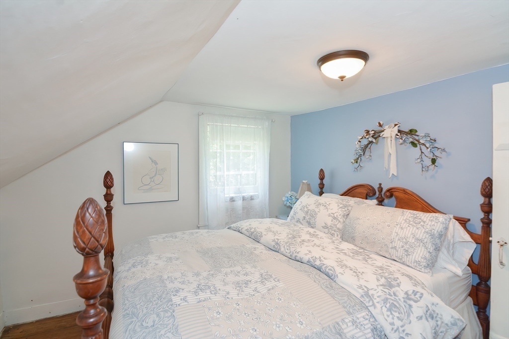 366 Breakneck Road Southbridge, MA 01550 - Photo 14 of 33 a bedroom with a bed and a painting on the wall
