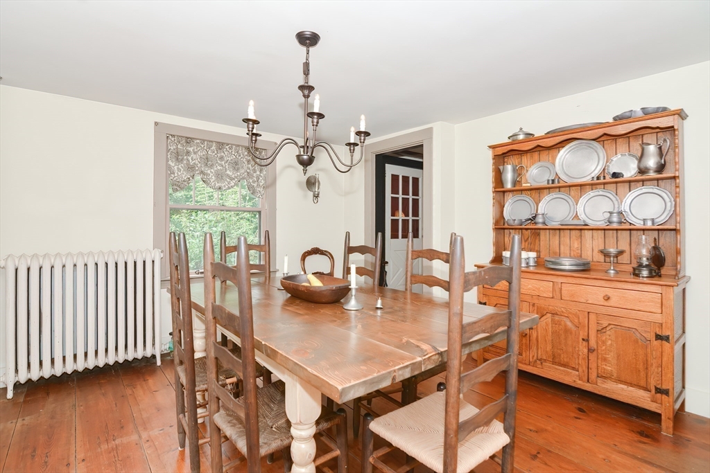 366 Breakneck Road Southbridge, MA 01550 - Photo 8 of 33 a dining room with furniture a chandelier and wooden floor