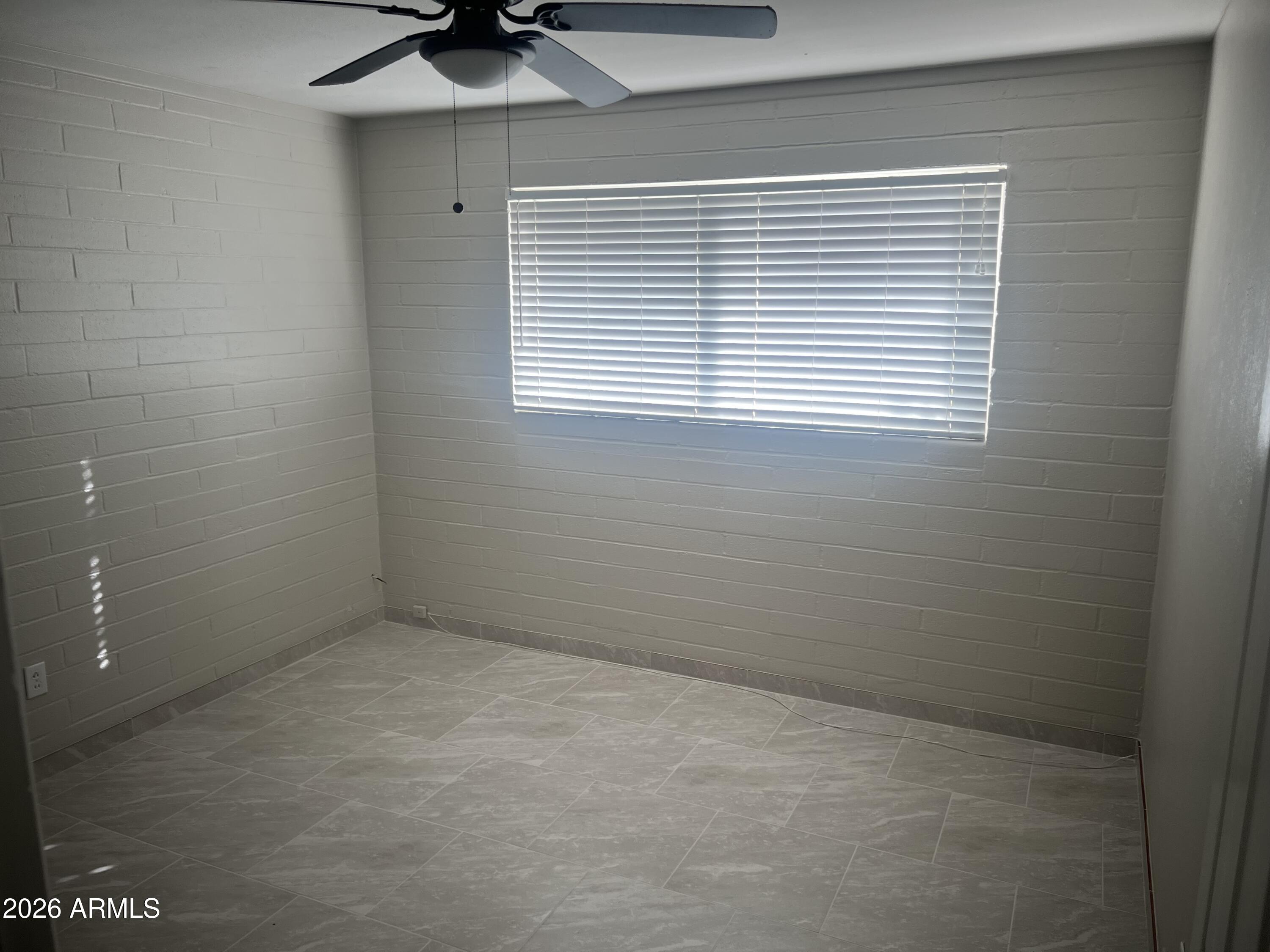 2420 West Butler Drive Phoenix, AZ 85021 - Photo 12 of 16 a view of an empty room with a window