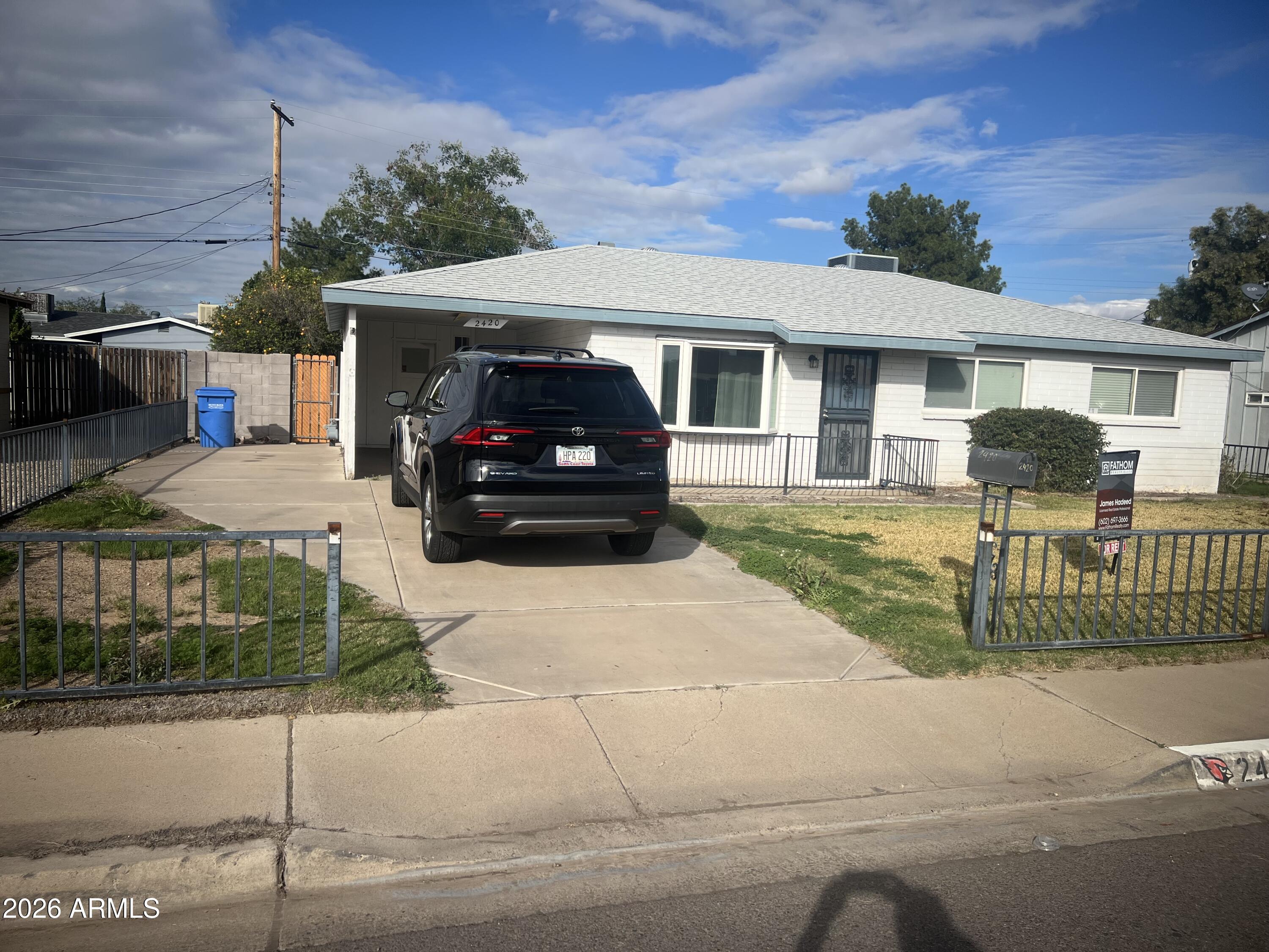 2420 West Butler Drive Phoenix, AZ 85021 - Photo 2 of 16 a house view with a garden space