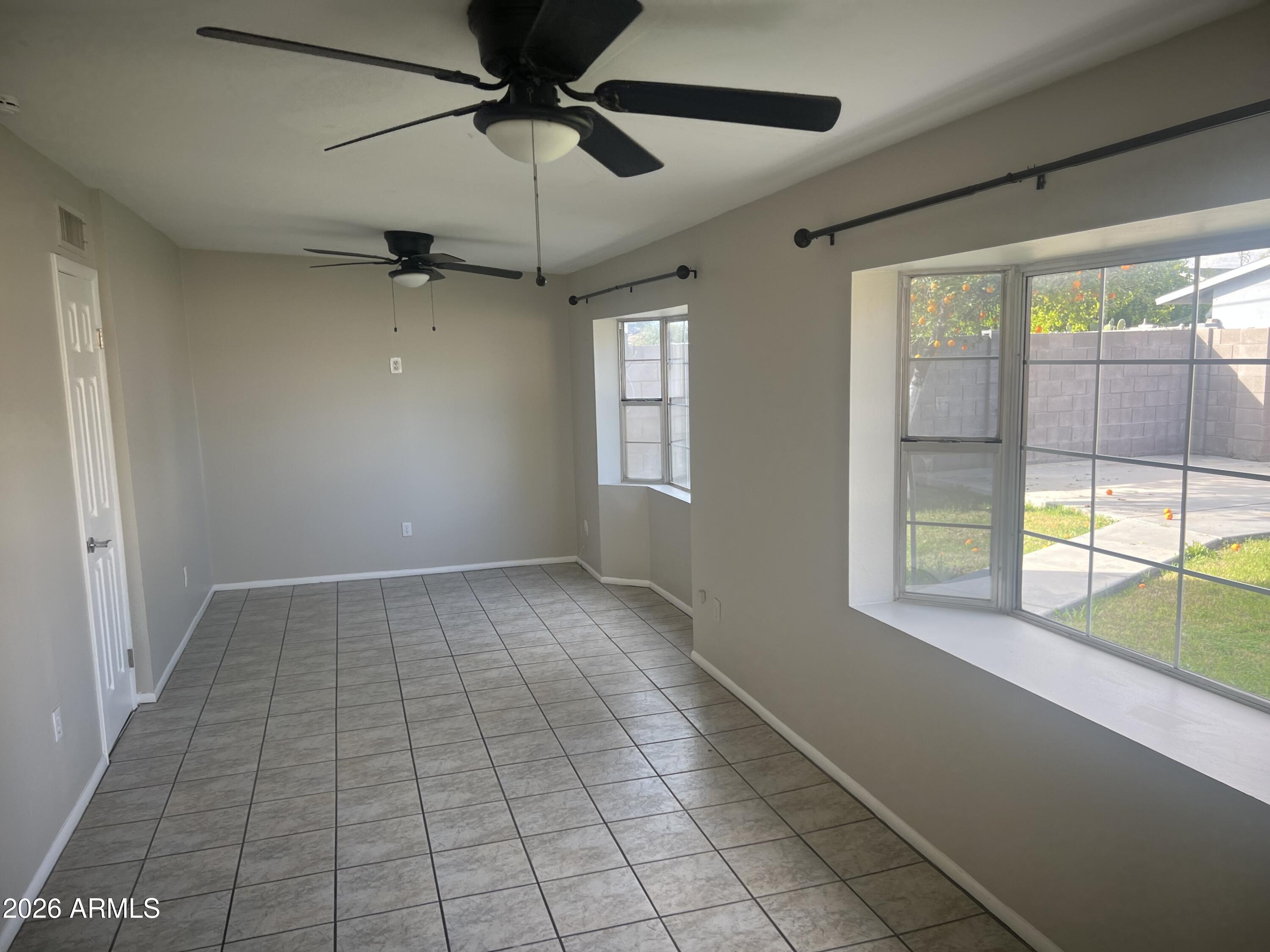 2420 West Butler Drive Phoenix, AZ 85021 - Photo 7 of 16 a view of an empty room with a window