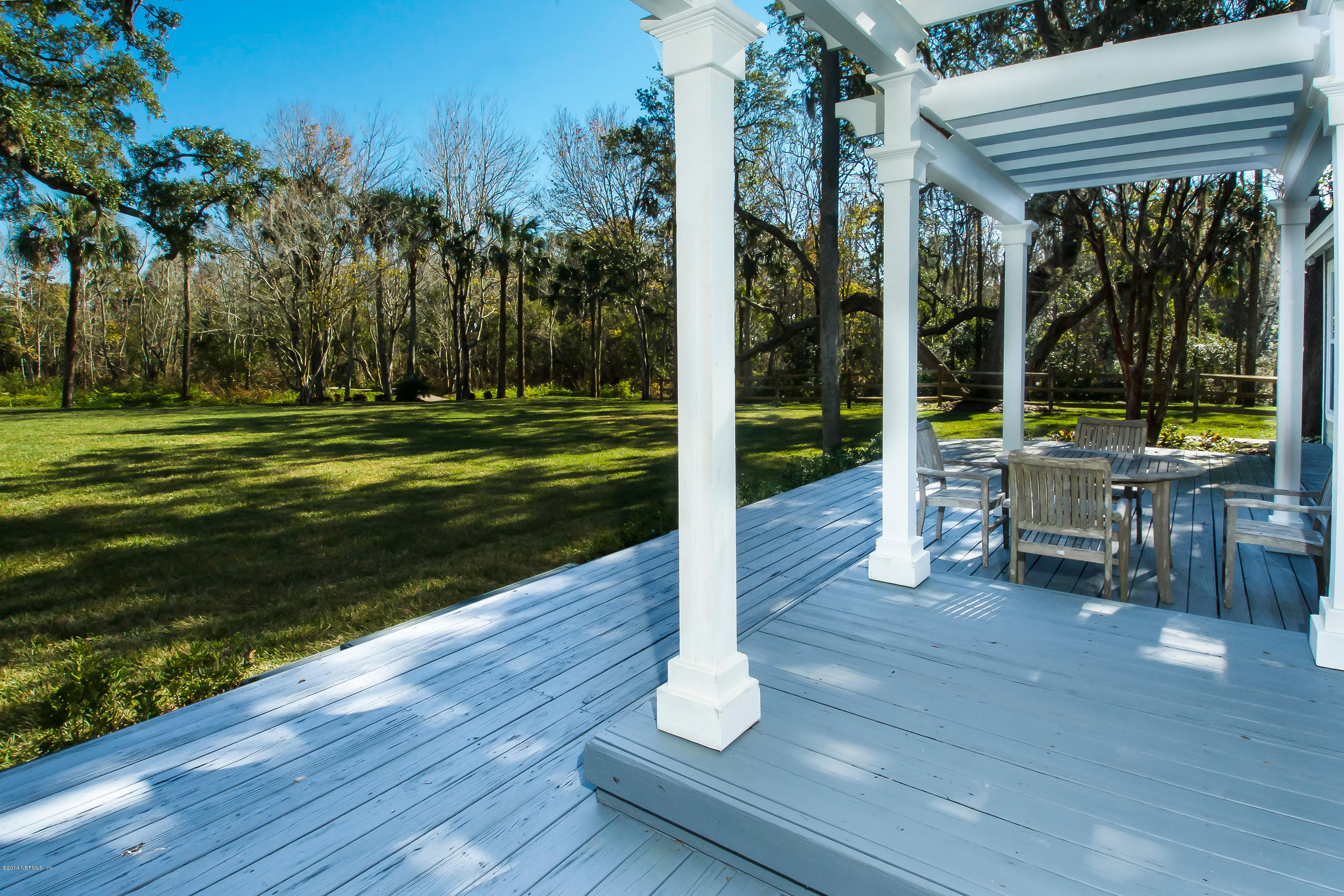 1122 Neck Road Ponte Vedra Beach, FL 32082 - Photo 19 of 35 a view of a swimming pool with a patio