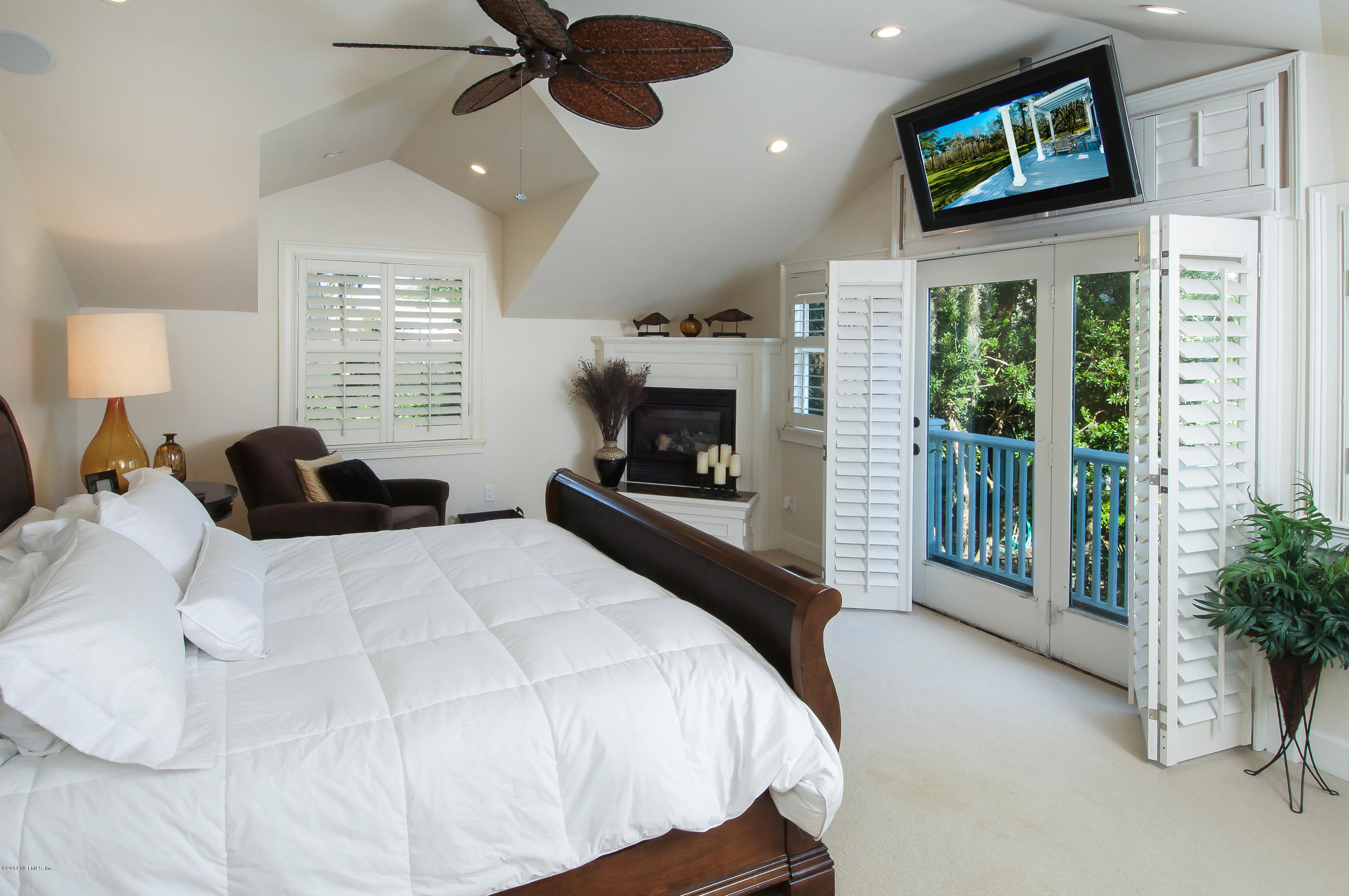 1122 Neck Road Ponte Vedra Beach, FL 32082 - Photo 21 of 35 a bedroom with a bed mirror and window
