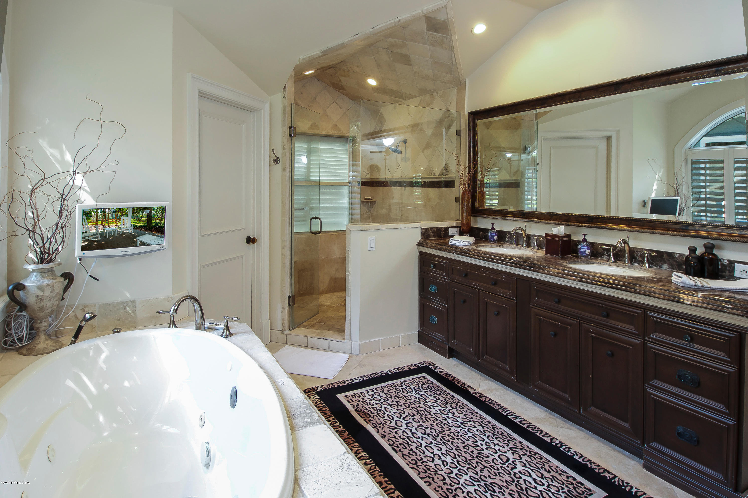 1122 Neck Road Ponte Vedra Beach, FL 32082 - Photo 22 of 35 a bathroom with a sink and a mirror