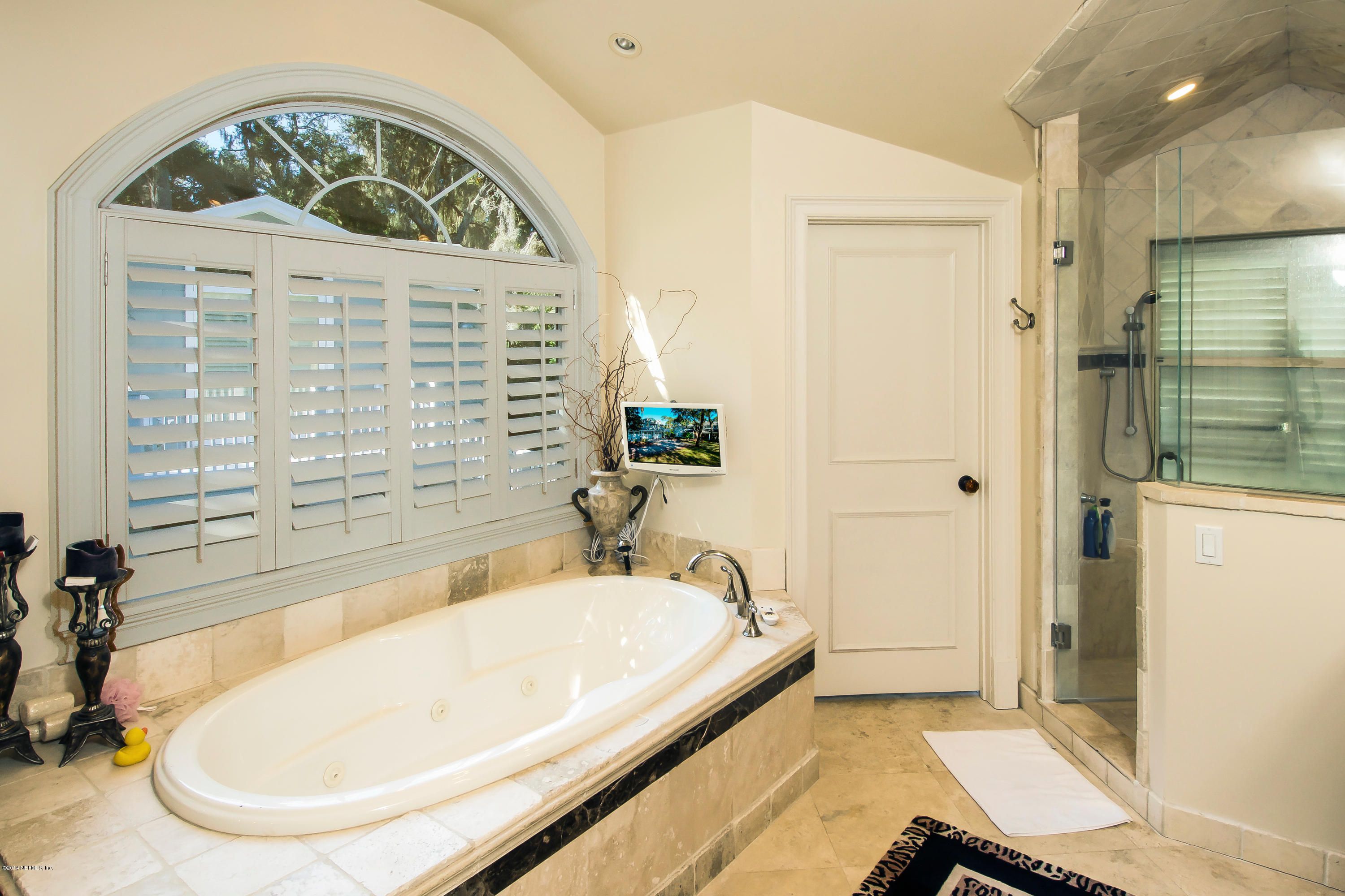 1122 Neck Road Ponte Vedra Beach, FL 32082 - Photo 23 of 35 a bathroom with a tub a sink and a shower