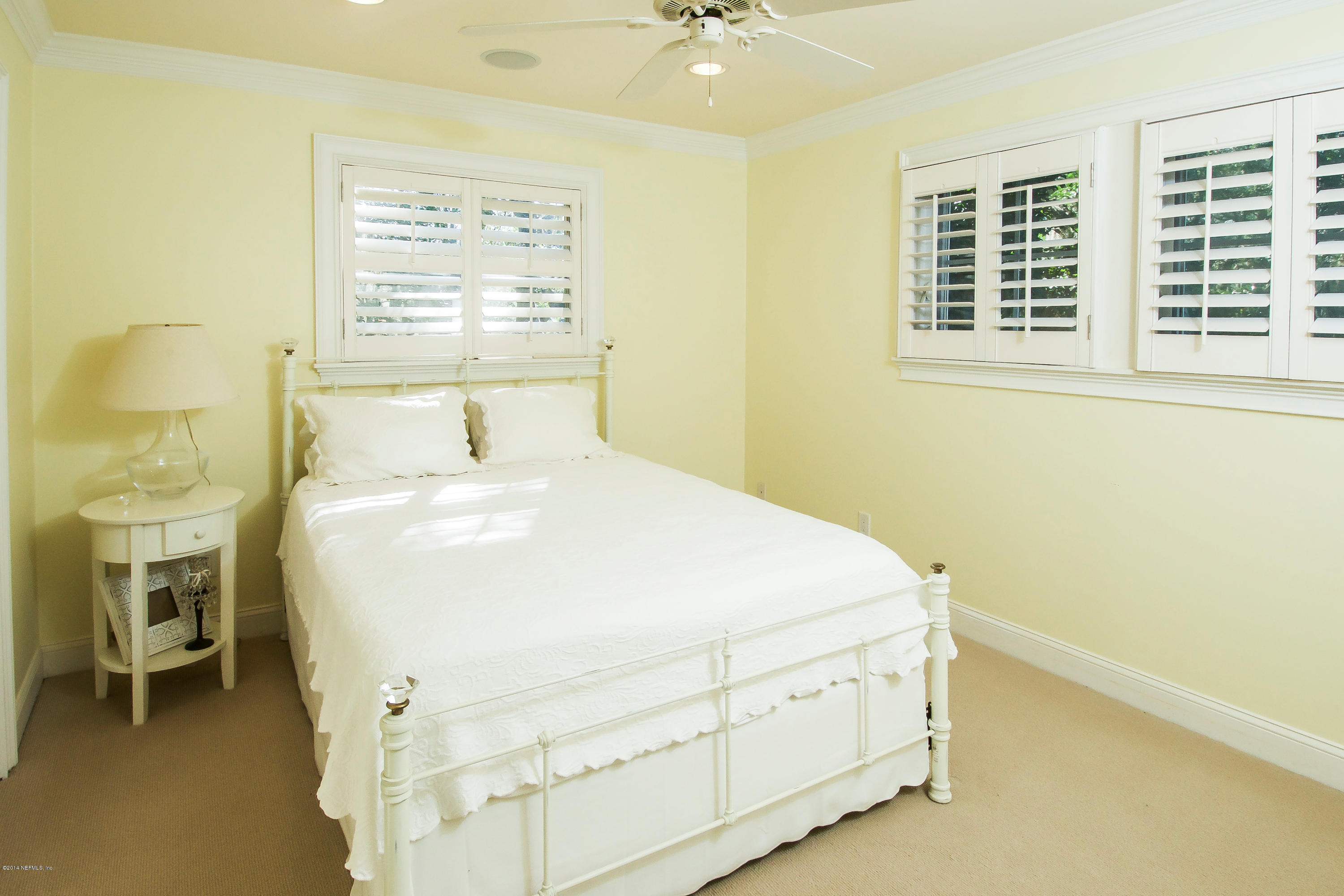 1122 Neck Road Ponte Vedra Beach, FL 32082 - Photo 24 of 35 a bedroom with a bed and a window