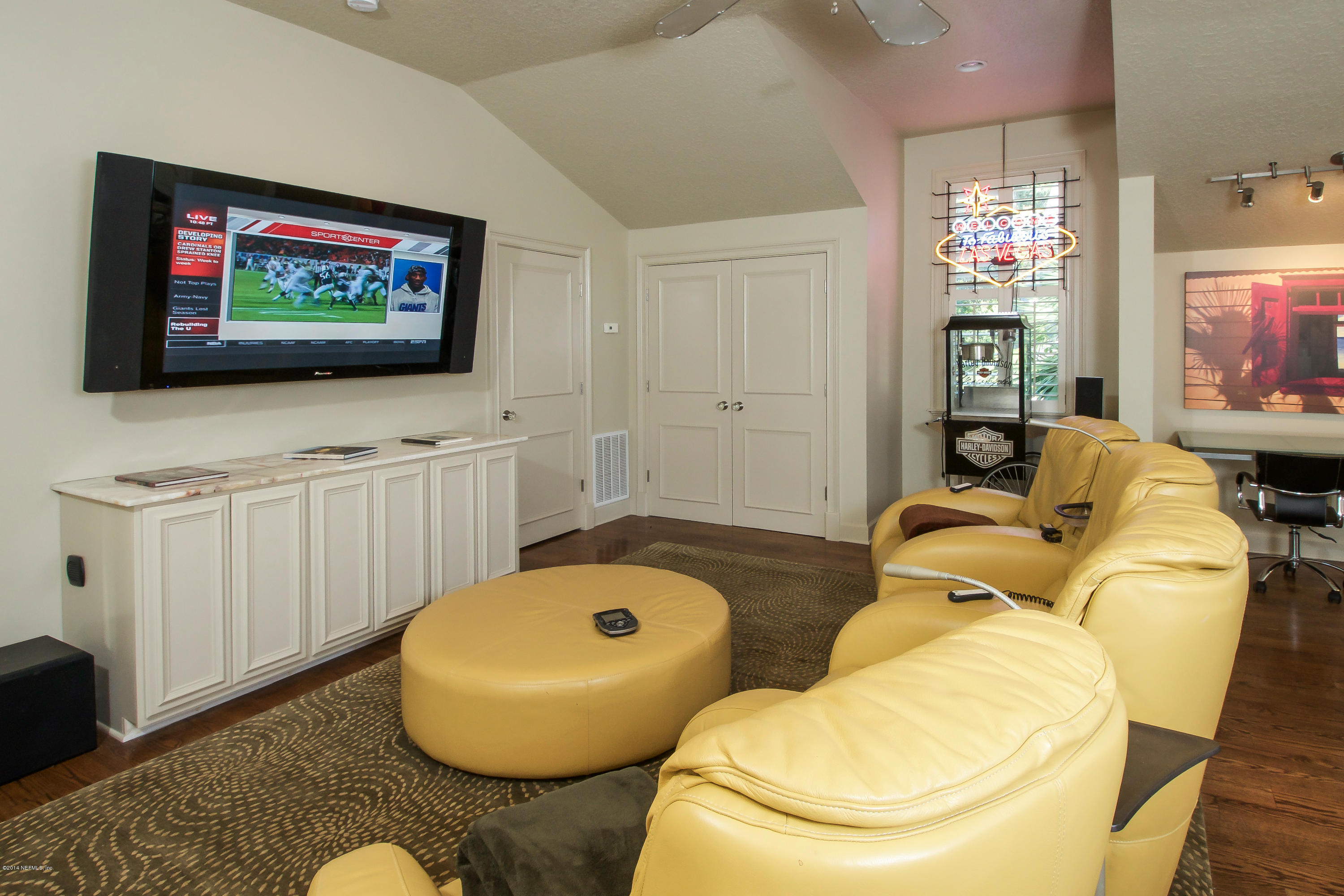 1122 Neck Road Ponte Vedra Beach, FL 32082 - Photo 26 of 35 a living room with furniture and a flat screen tv