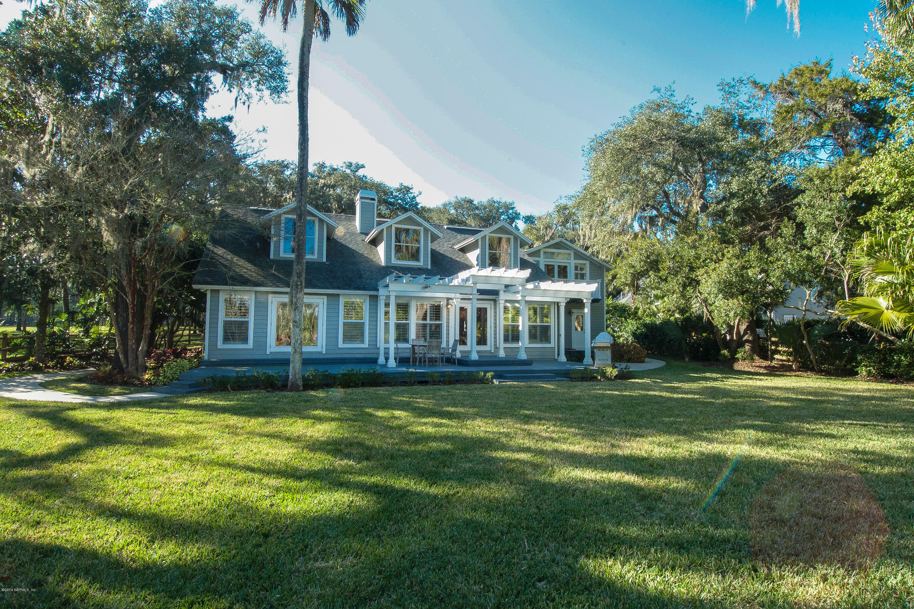 1122 Neck Road Ponte Vedra Beach, FL 32082 - Photo 29 of 35 a view of a house with a garden