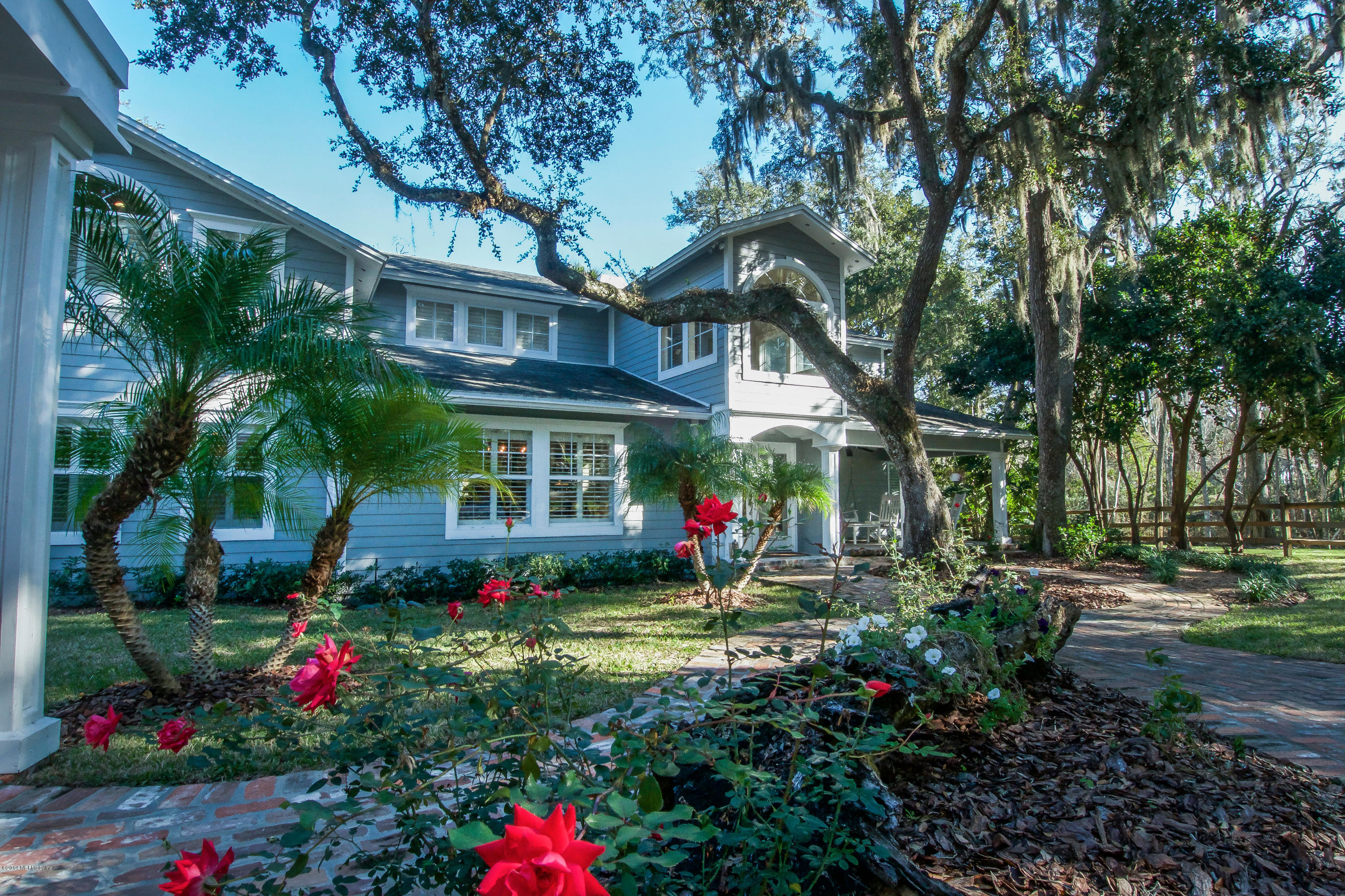 1122 Neck Road Ponte Vedra Beach, FL 32082 - Photo 3 of 35 a view of a house with a yard and garden