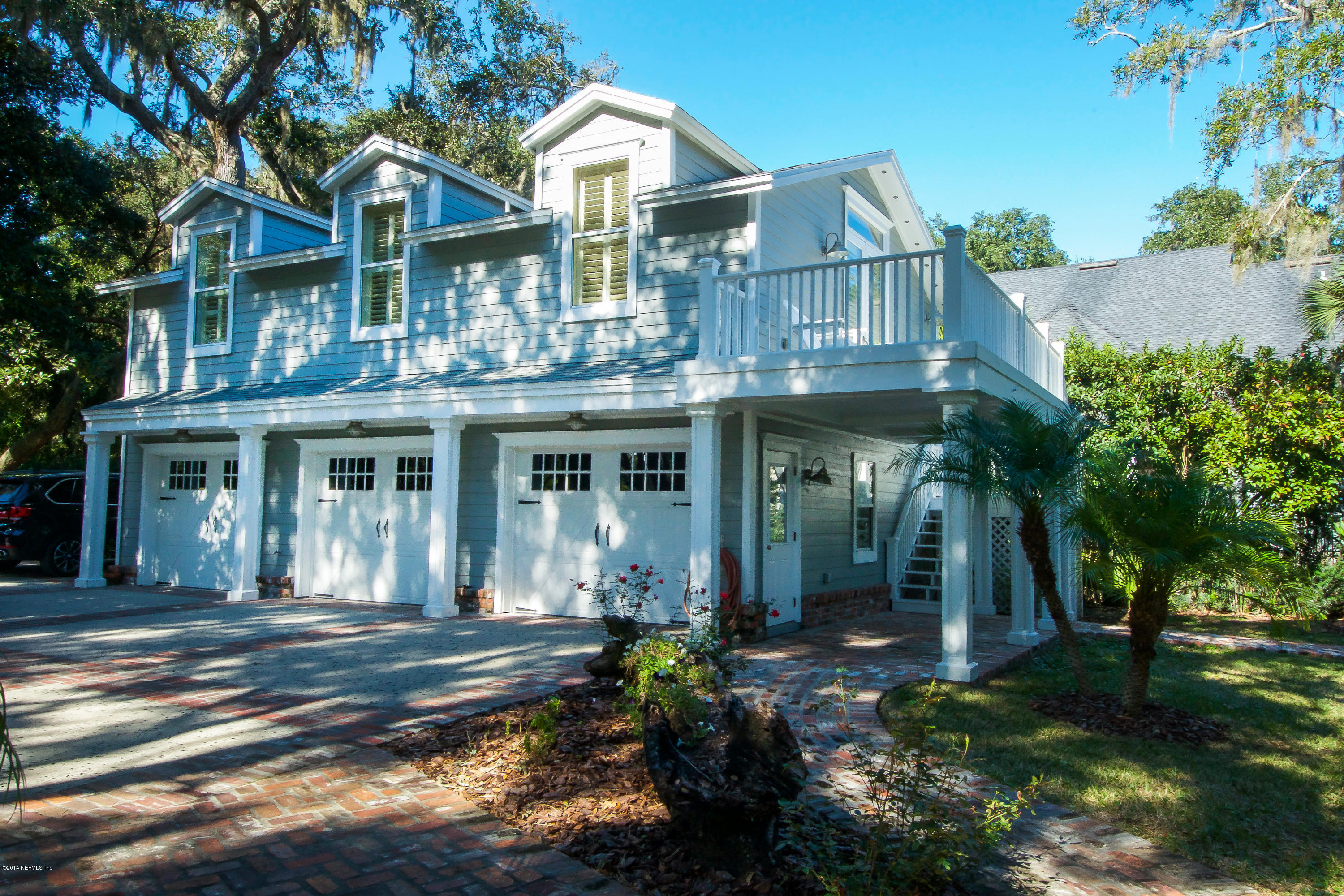 1122 Neck Road Ponte Vedra Beach, FL 32082 - Photo 5 of 35 a front view of a house with a yard