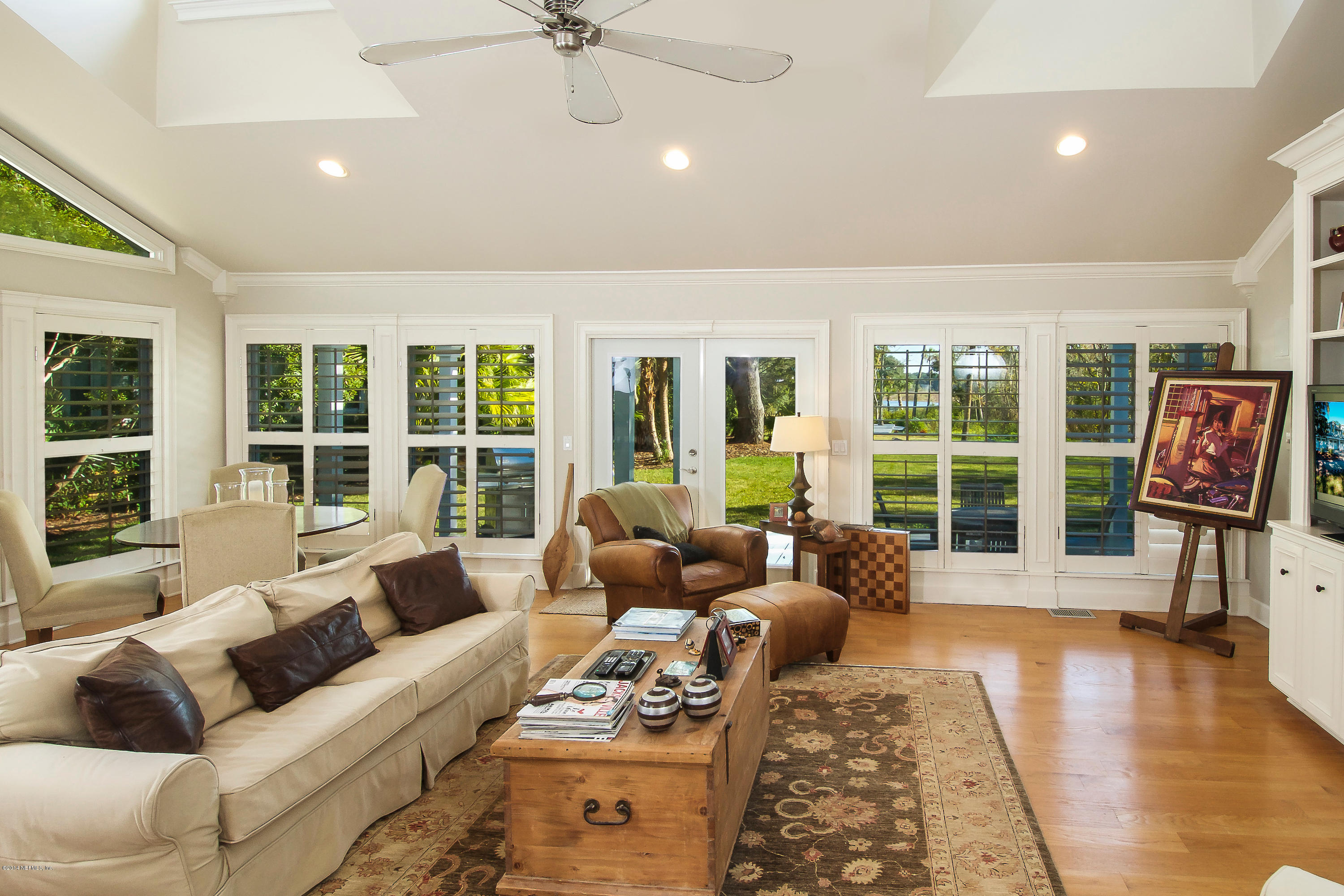 1122 Neck Road Ponte Vedra Beach, FL 32082 - Photo 7 of 35 a living room with furniture and floor to ceiling windows