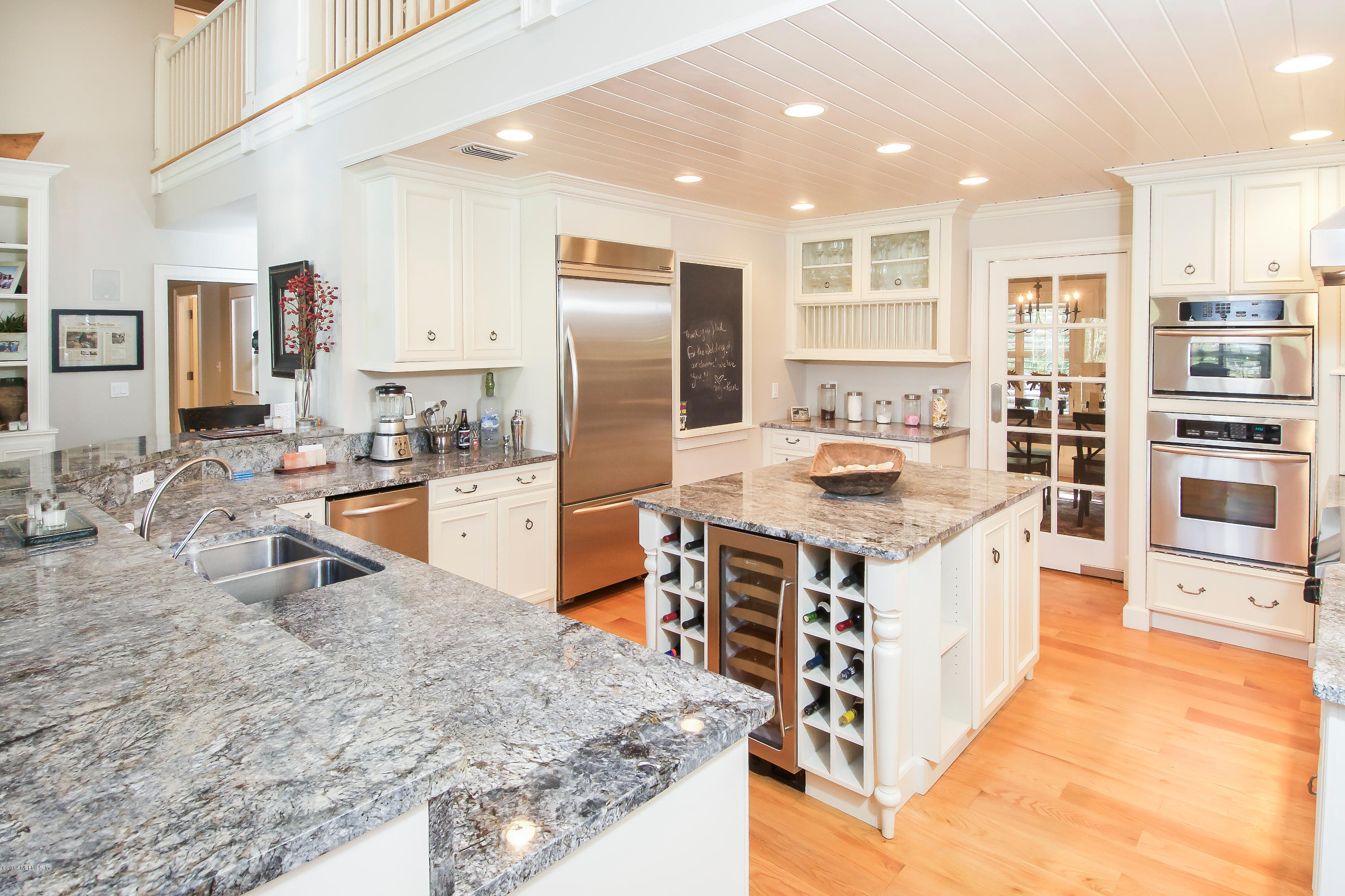 1122 Neck Road Ponte Vedra Beach, FL 32082 - Photo 9 of 35 a kitchen with stainless steel appliances granite countertop a stove oven and a refrigerator
