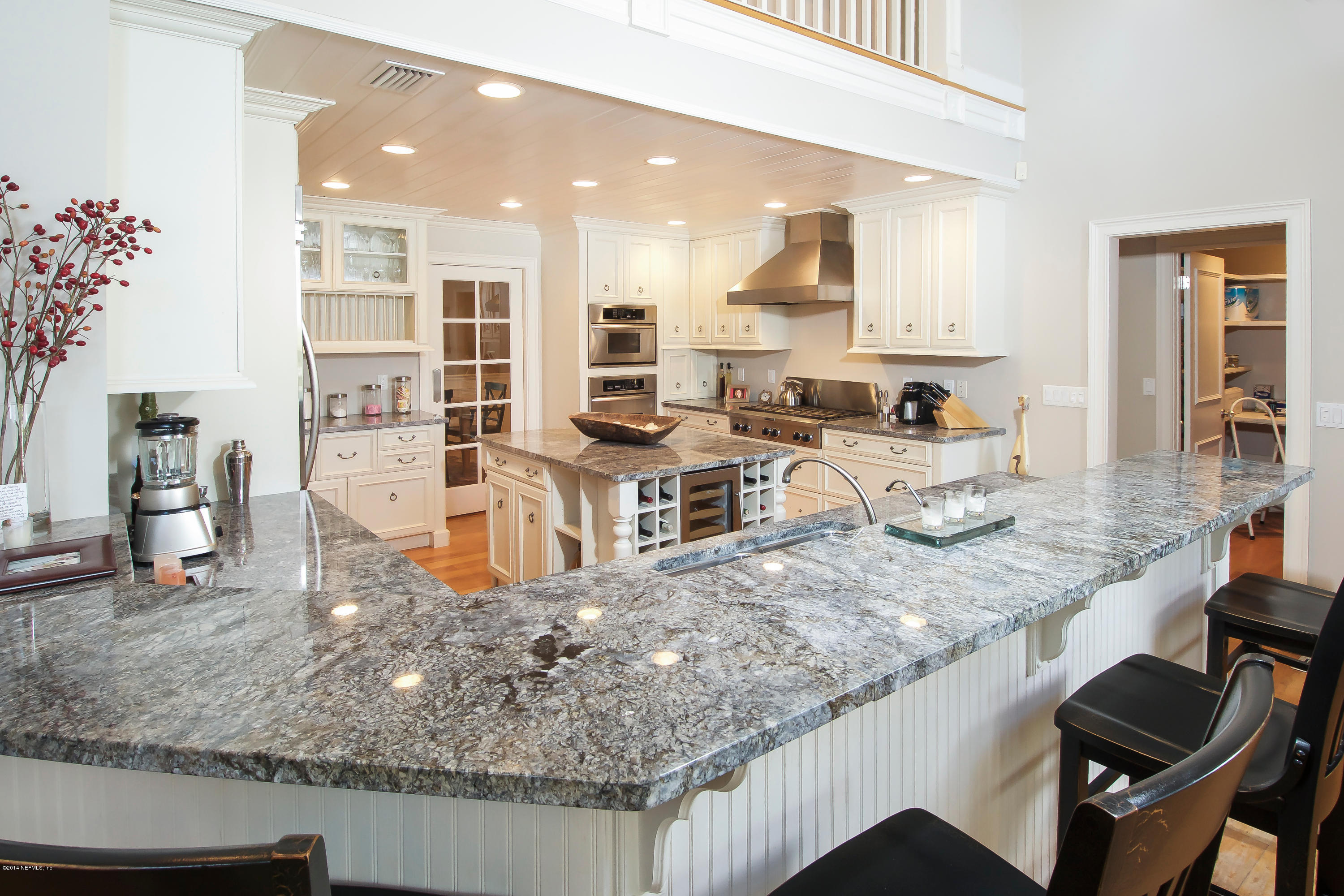 1122 Neck Road Ponte Vedra Beach, FL 32082 - Photo 10 of 35 a kitchen with stainless steel appliances granite countertop a sink stove and cabinets
