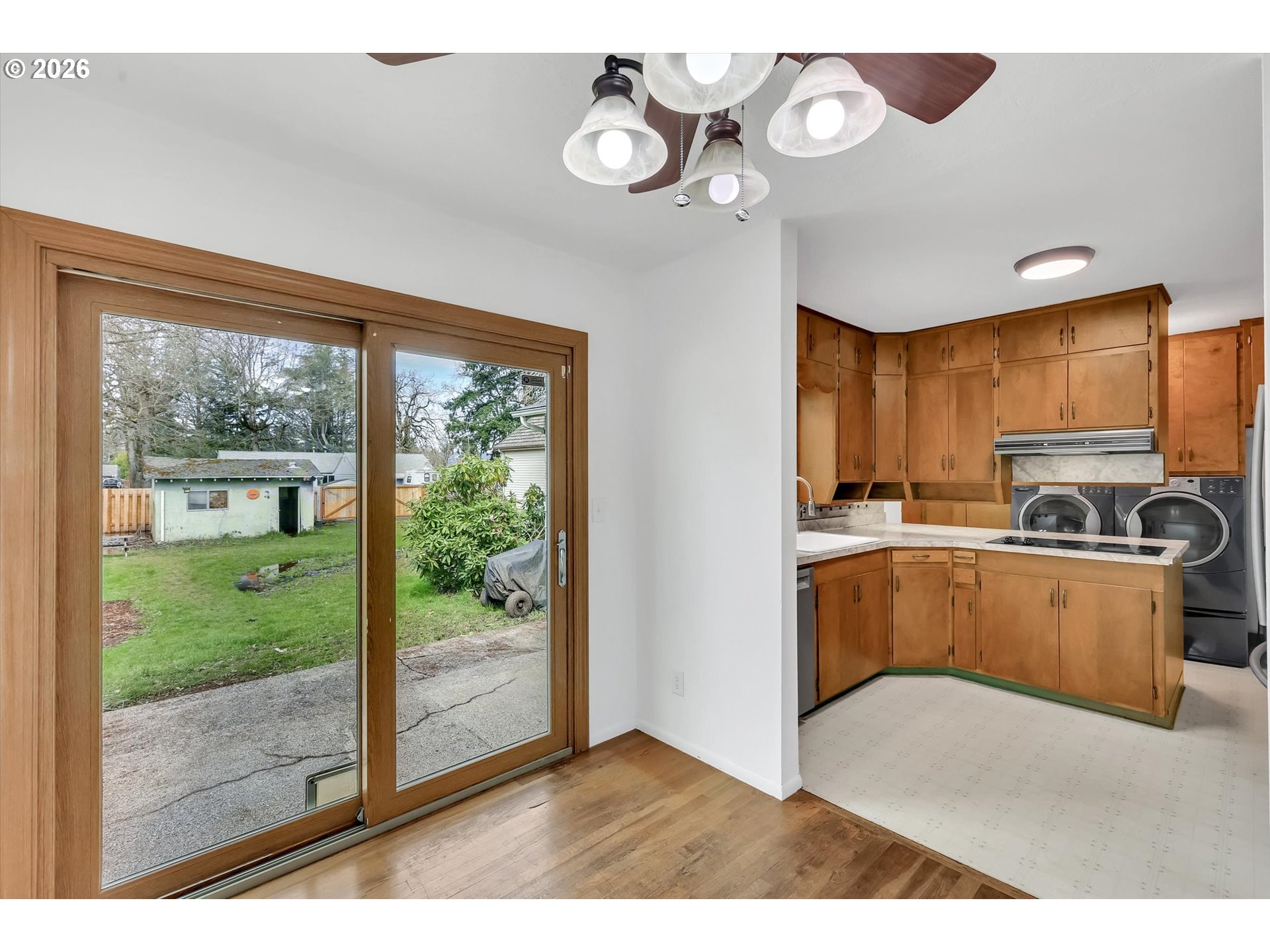 515 Harrison Street Fairview, OR 97024 - Photo 11 of 38 a kitchen with a refrigerator and a view of living room