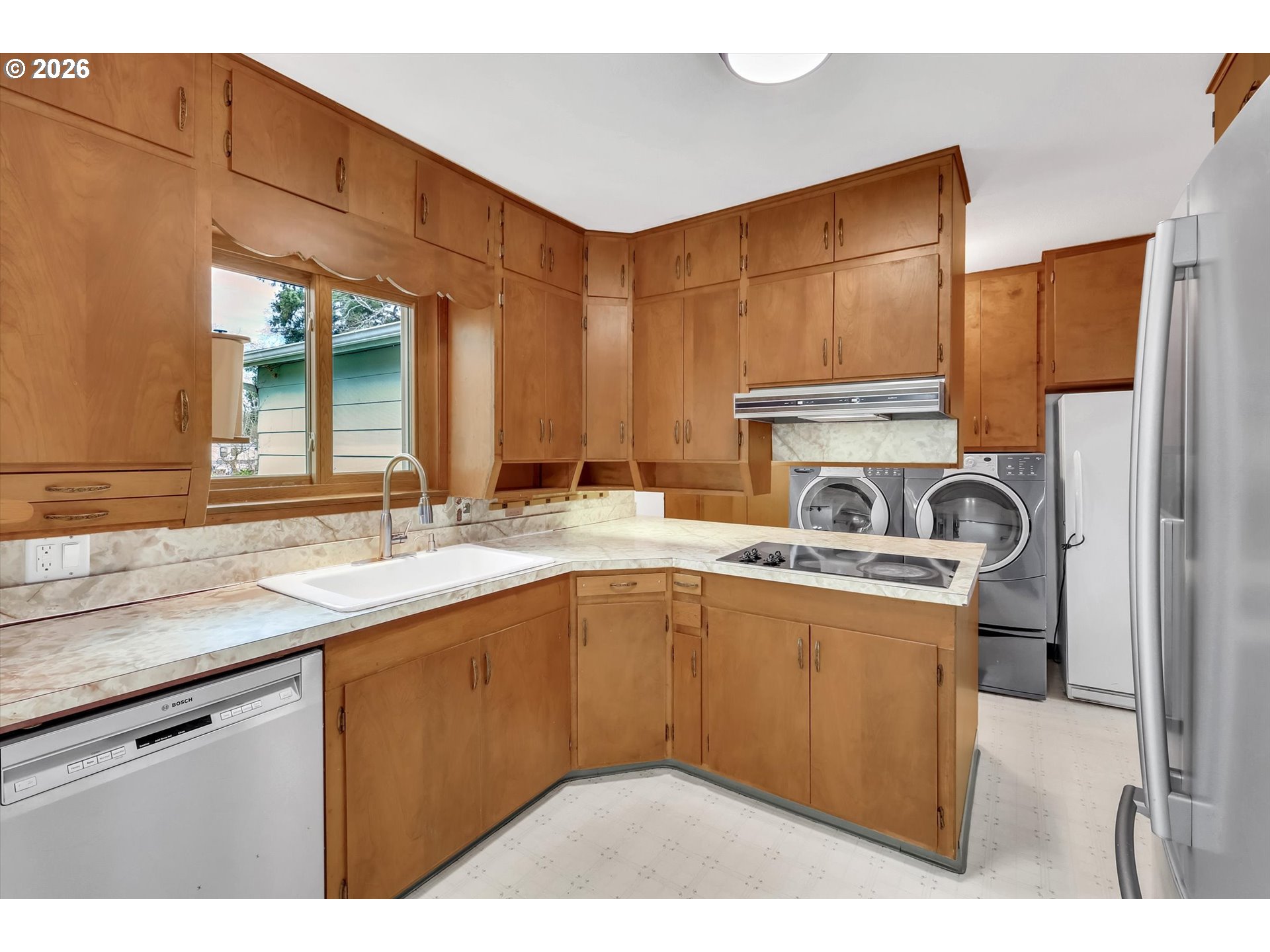 515 Harrison Street Fairview, OR 97024 - Photo 13 of 38 a kitchen with a sink a stove and cabinets